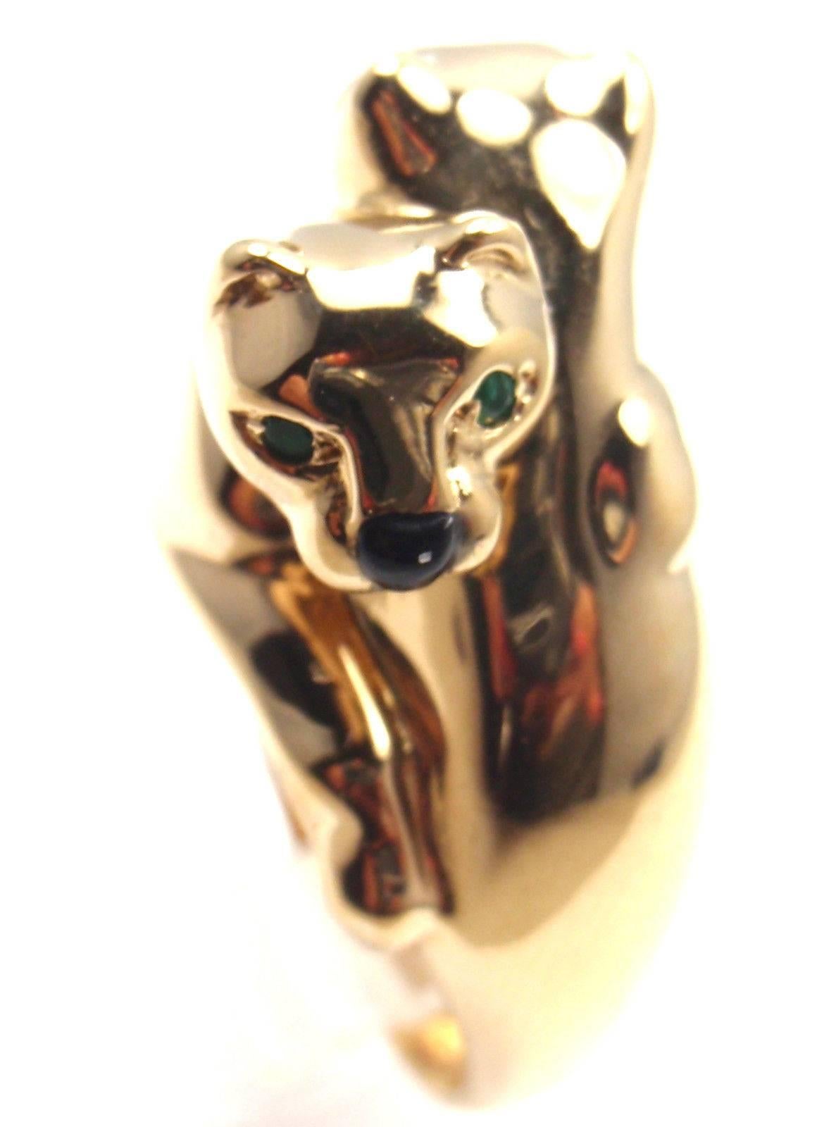 18k Yellow Gold Double Panther Emerald & Black Onyx Ring. 
With 4 Emerald Eyes, and 2 Onyx Noses. 

Details: 
Ring Size: European 53 US 6 1/4 
Weight: 15.3 grams
Width: 13mm 
Stamped Hallmarks: Cartier 750 53 617599

*Free Shipping within the United