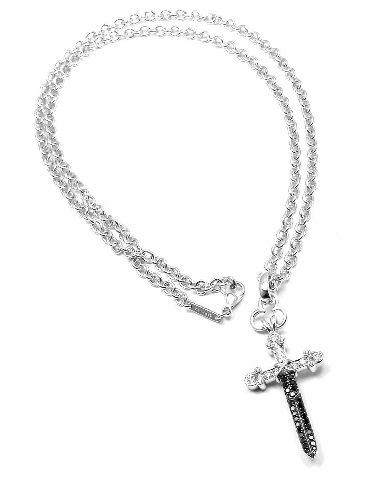 18k White Gold White And Black Diamond Sword Dagger Pendant Necklace by Gerrard from Knightrider collection. 
With 17 white round brilliant cut diamonds VS1 clarity, G color
29 round black diamonds 
Total weight of all diamonds is approx.