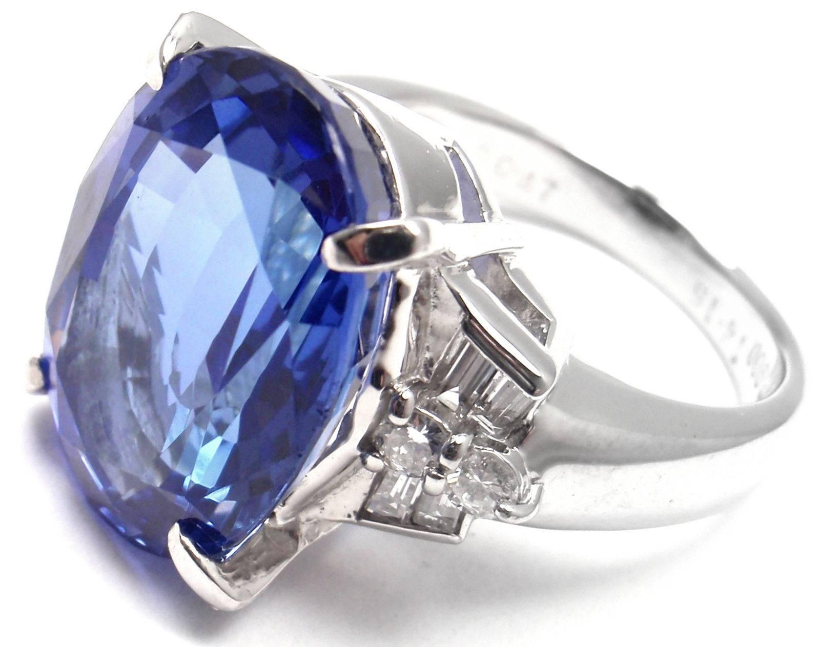 Gorgeous! Estate Platinum Large 14.15ct Tanzanite And Diamond Cocktail Ring. 
This ring comes with Japanese Certificate for Tanzanite.
With1 Oval Shape Natural Tanzanite
Tanzanite Measurements 17.29 x 12.71 x 7.52mm Color Purple 
.47ct total