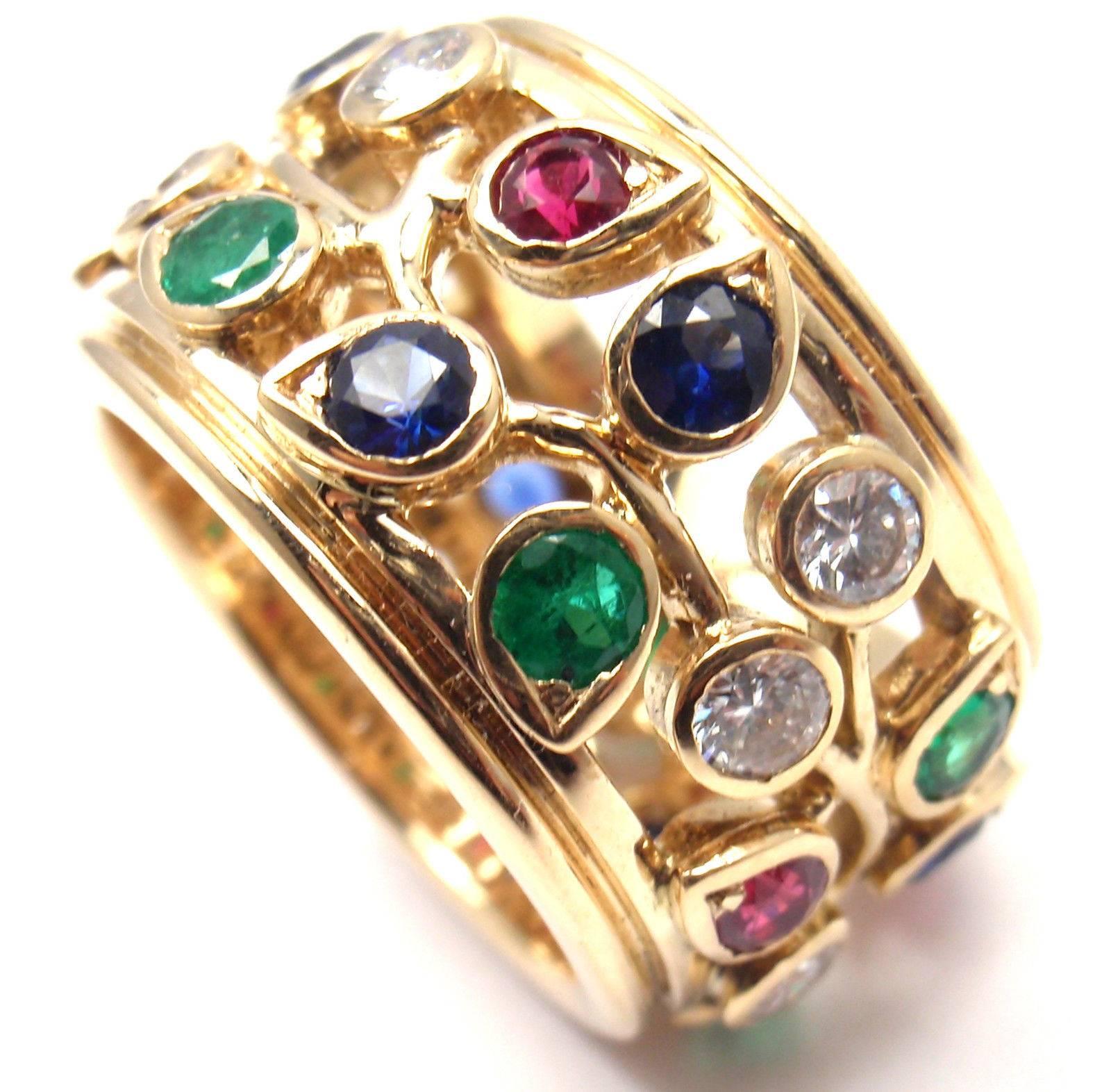 18k Yellow Gold Diamond Sapphire Emerald Ruby Wide Band Ring by Cartier.
With 8 Round brilliant cut diamonds VVS1 clarity, G color total weight approximately .64ct
With 9 round brilliant cut diamonds total weight approx .72ct. 
Diamonds VS1 clarity,