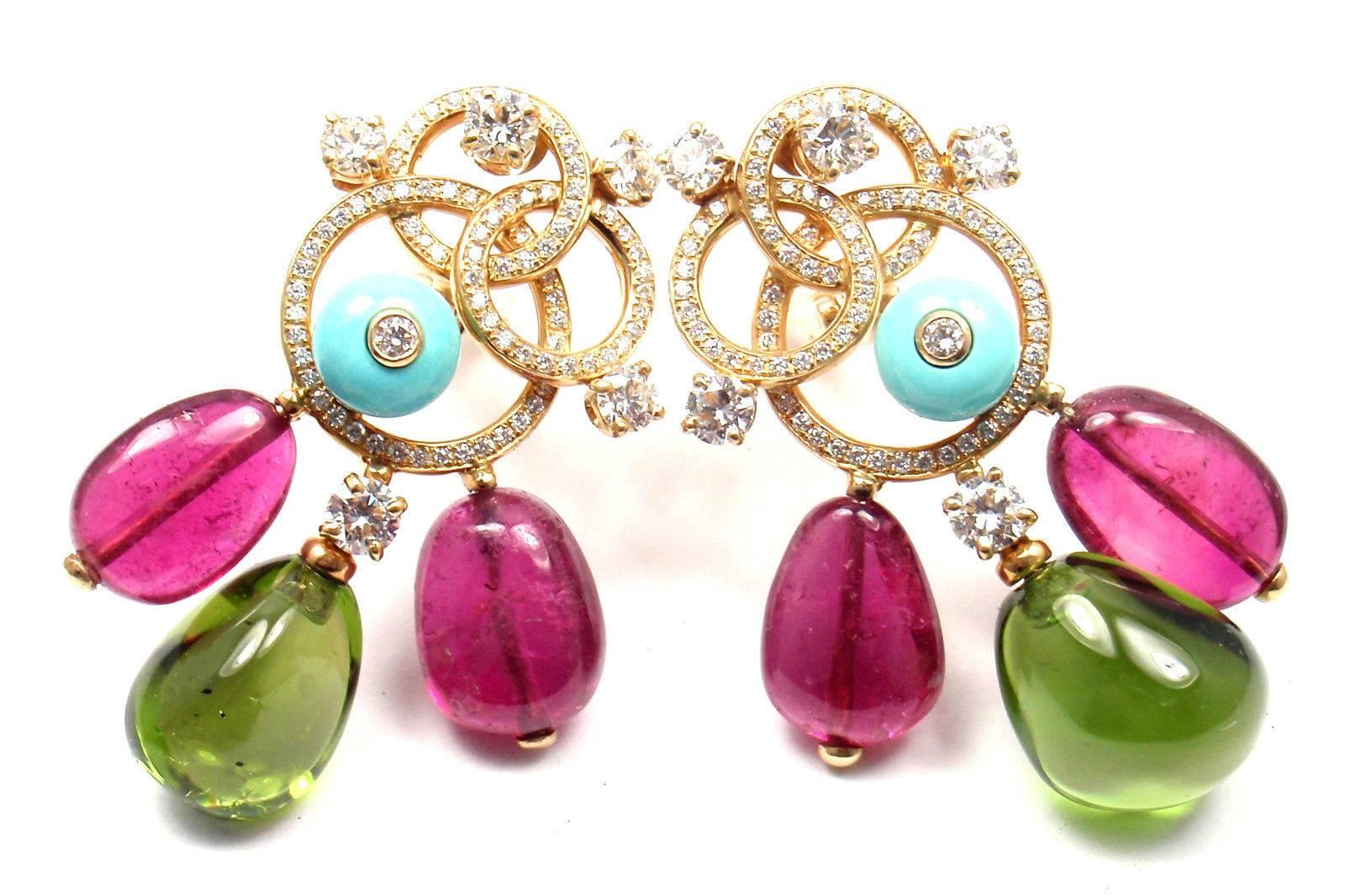 18k yellow gold diamond, turquoise, pink and green tourmaline earrings by Bulgari.
With 166 round brilliant cut diamonds VS1 clarity, E color total weight approx. 3ct
2 Green Tourmalines 10mm x 8mm each
4 Pink Tourmalines 9mm x 10mm each
2 Turqouise