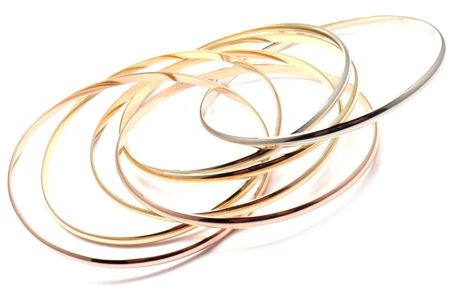 CARTIER 18k Tri-Color Gold Trinity Rolling Seven Bangles Bracelet

This bracelet comes with original Cartier box.

Details:

Metal: 18k White, Yellow & Rose Gold
Length: 7