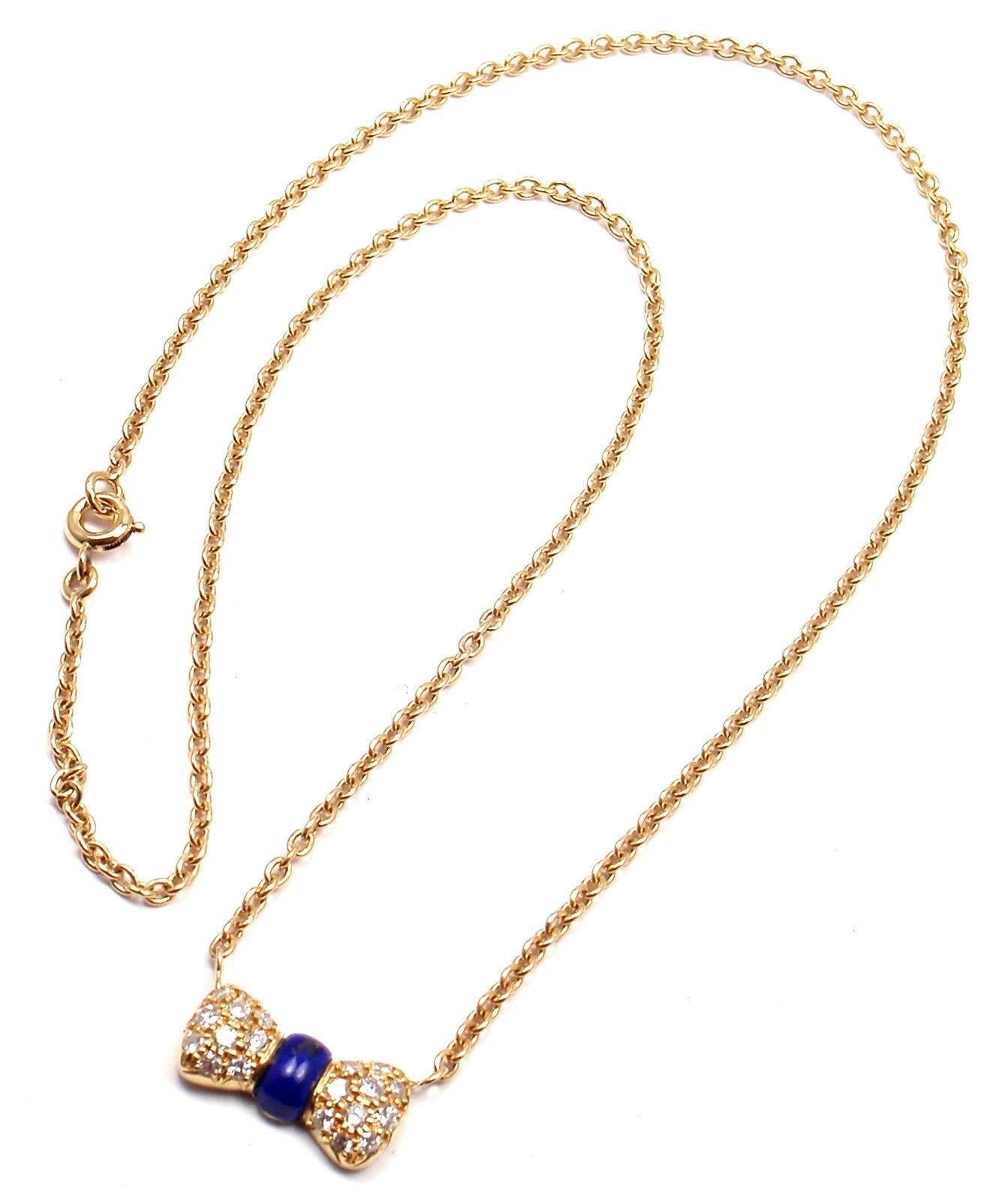 18k Yellow Gold Diamond Lapis Lazuli Bow Necklace by Van Cleef & Arpels. With 20 diamond VVS1 clarity, G color total weight .10ct  

Details: 
Necklace Length: 15.5''
Pendant: 15mm x 8mm
Weight: 5.5 grams
Stamped Hallmarks: VCA 18k 83 BOCT39