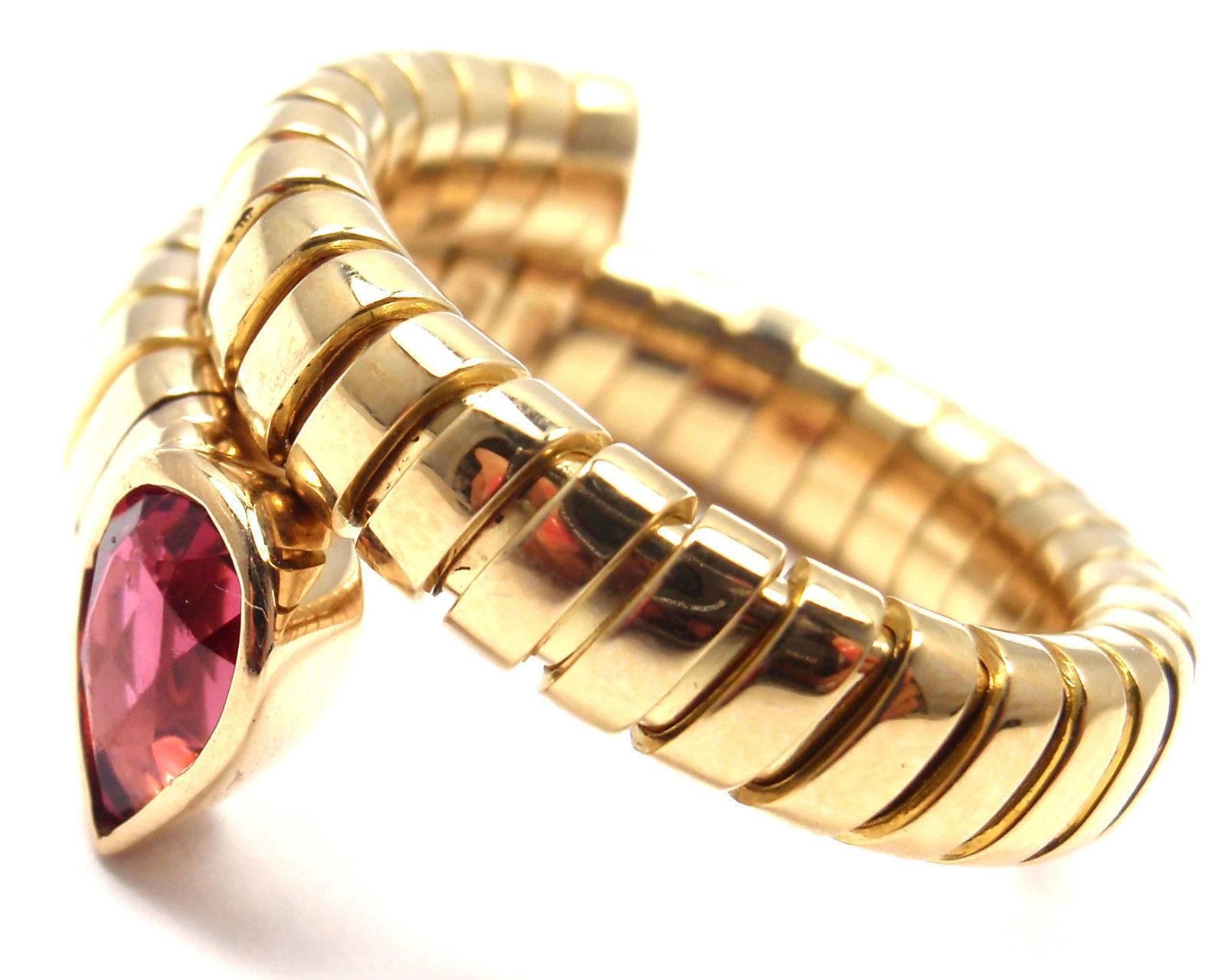 18k Yellow Gold Ruby Coil Snake Ring by Bulgari. 
With 1 pear shape ruby total weight approx. .50ct

Details:
Ring Size: 8 - 9 (the ring stretches)
Width: 13mm
Weight: 11.4 grams
Stamped Hallmarks:  Bulgari, 750

*Free Shipping within the United