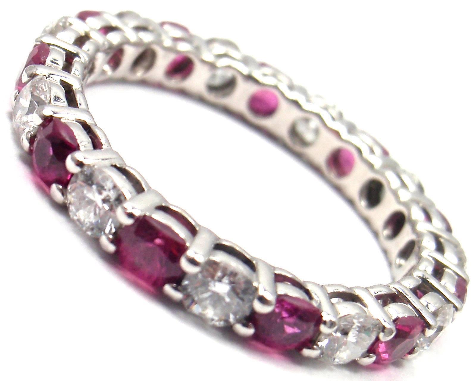 Tiffany & Co Platinum Diamond And Ruby Shared Setting Band Ring. 
With 11 round brilliant cut diamonds VS1 clarity, E color total weight approx. .96ct
11 round rubies total weight approx. 1.20ct

Measurements:  
Ring Size: 6
Weight: 3.3 grams
Band