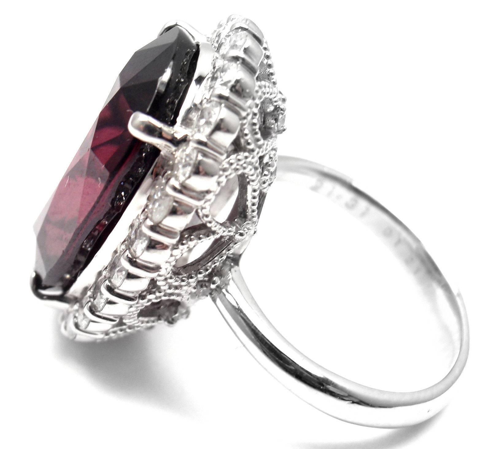 Gorgeous! Platinum Large  21.31ct Garnet And 1.21ct Diamond Cocktail Ring.  
With1 1 Oval Shape Natural Garnet
Garnet Measurements 10 x 9 x 10mm
Color Dark Red
25 round brilliant cut diamonds VS2 clarity, G color total weight approx. 1.21ct total