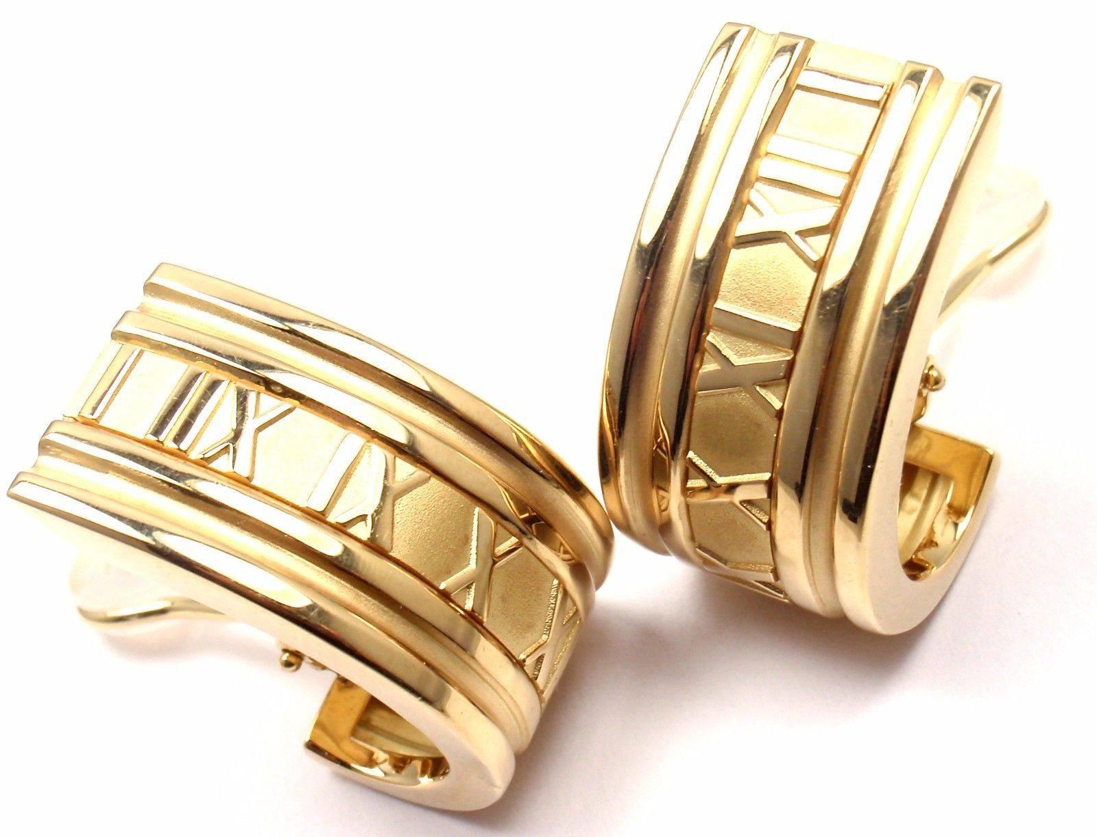 18k Yellow Gold Extra Large Atlas Hoop Earrings by Tiffany & Co.  
These earrings have collapsible posts with omega backs.  

Details:  
Measurements: 31mm x 16mm  
Weight:  25.6 grams
Stamped Hallmarks: Tiffany & Co, 750, 1995, Italy

*Free