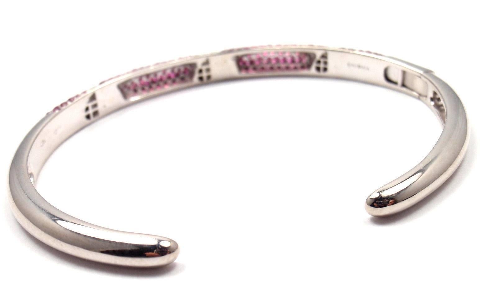 18k White Gold Diamond And Pink Sapphire Bangle Bracelet Enigma by Gianni Bulgari. 
With 30 brilliant cut diamonds VS1 clarity, G color total weight approx. .25ct
round pink sapphire stones.

Details: 
Length: 7"
Width: 6mm
Weight: 19.1