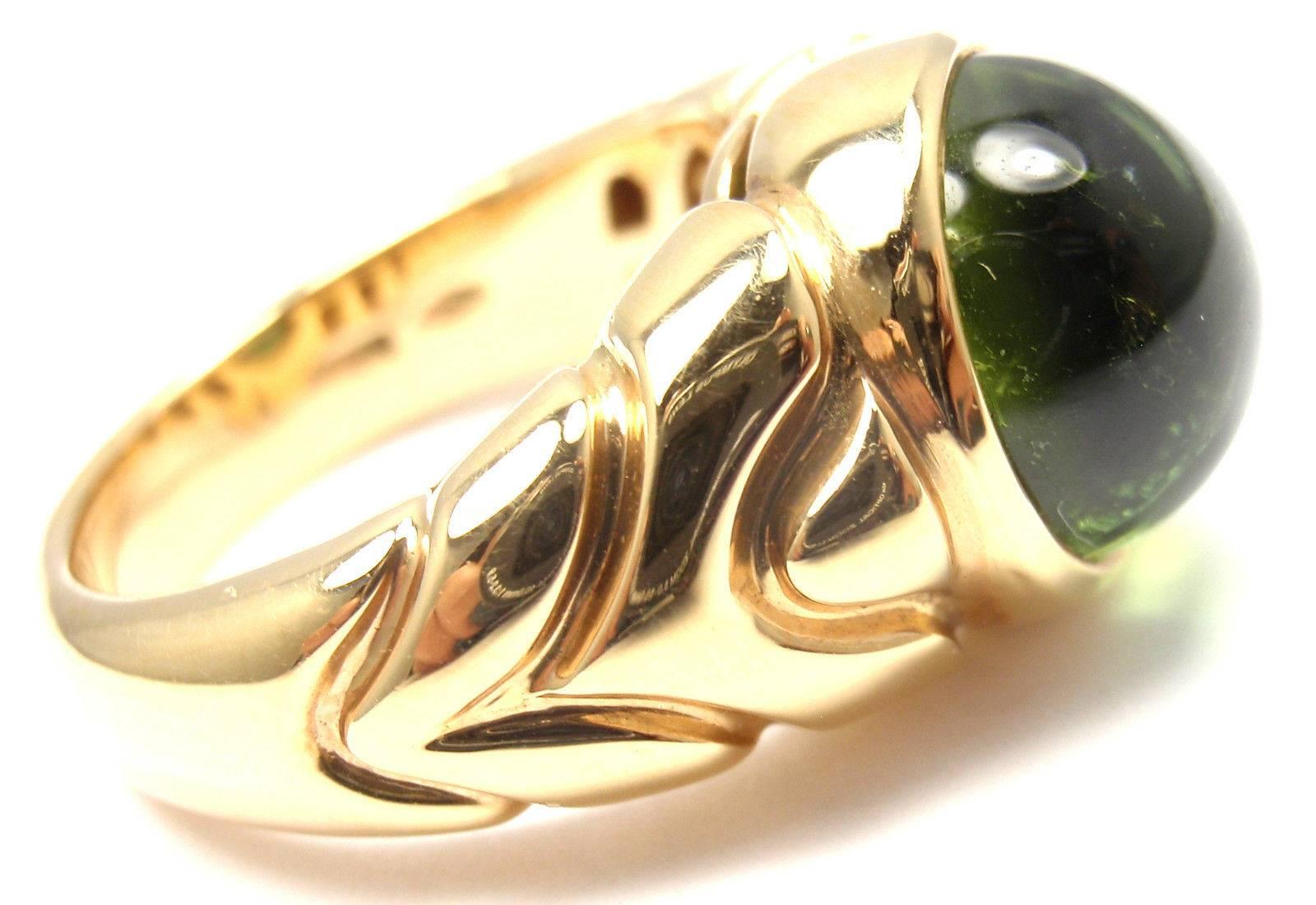 18k Yellow Gold Gold Green Tourmaline Ring by Bulgari. 
With 1 round green tourmaline 10mm

Details: 
Ring Size: 5.5 (resize available)
Width: 12mm
Weight: 11.2 grams
Stamped Hallmarks: Bvlgari, 750, 1970AL

*Free Shipping within the United