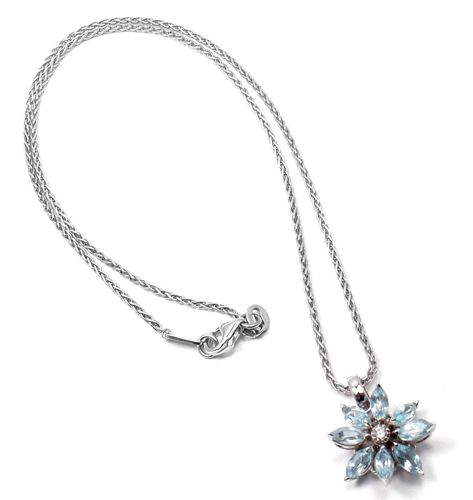 18k White Gold Diamond and Aquamarine Petal Flower Pendant Necklace 
by Asprey.
With marquise shaped aquamarine 5mm each
1 Diamond totaling approximately .20 ctw
Retail Price: $6700.00

Details:
Weight: 8.3 grams
Chain Length: 16"
Pendant: 