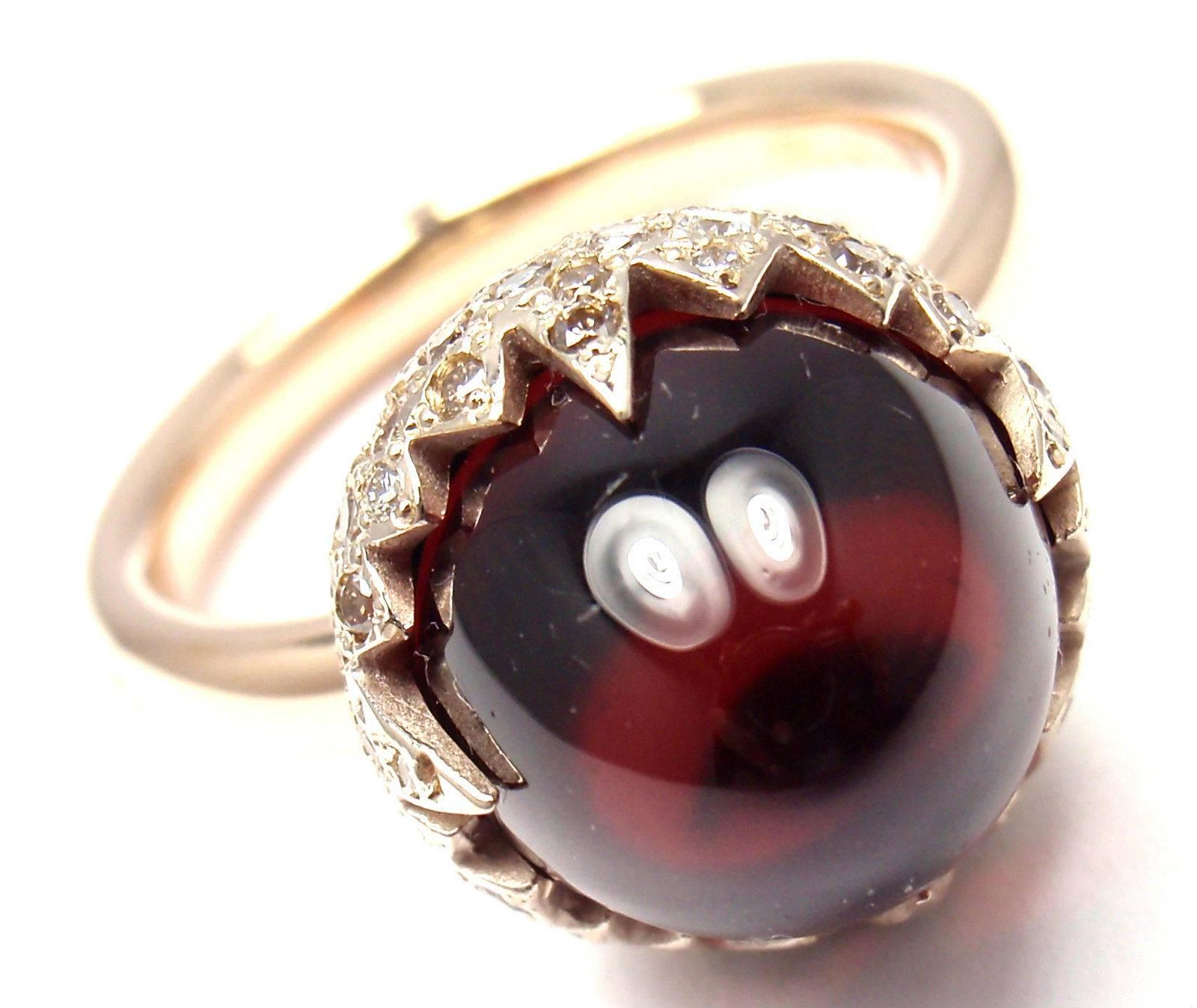 18k Rose & White Gold Garnet Diamond Chimera Ring by Pomellato.
With 1 Garnet 11mm x 13mm
Round Brilliant Cut Diamonds total weight approx. .25ct

This ring comes with original Pomellato box and a certificate.

Details:
Ring Size: 5
Width: 