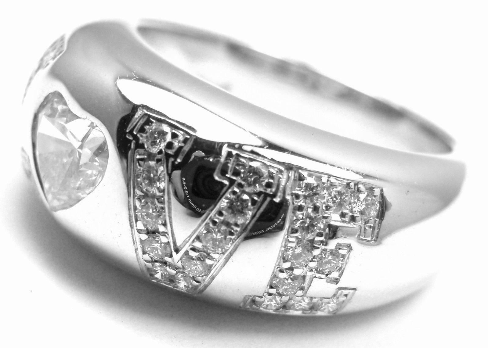 18k White Gold Heart Shape .53ct Diamond Love Band Ring by Chopard. 
This ring comes with the Chopard paper and a box.
With
1 heart shape diamond VS1 clarity, G color total weight .53ct
28 round brilliant cut diamonds VS1 clarity, G color total