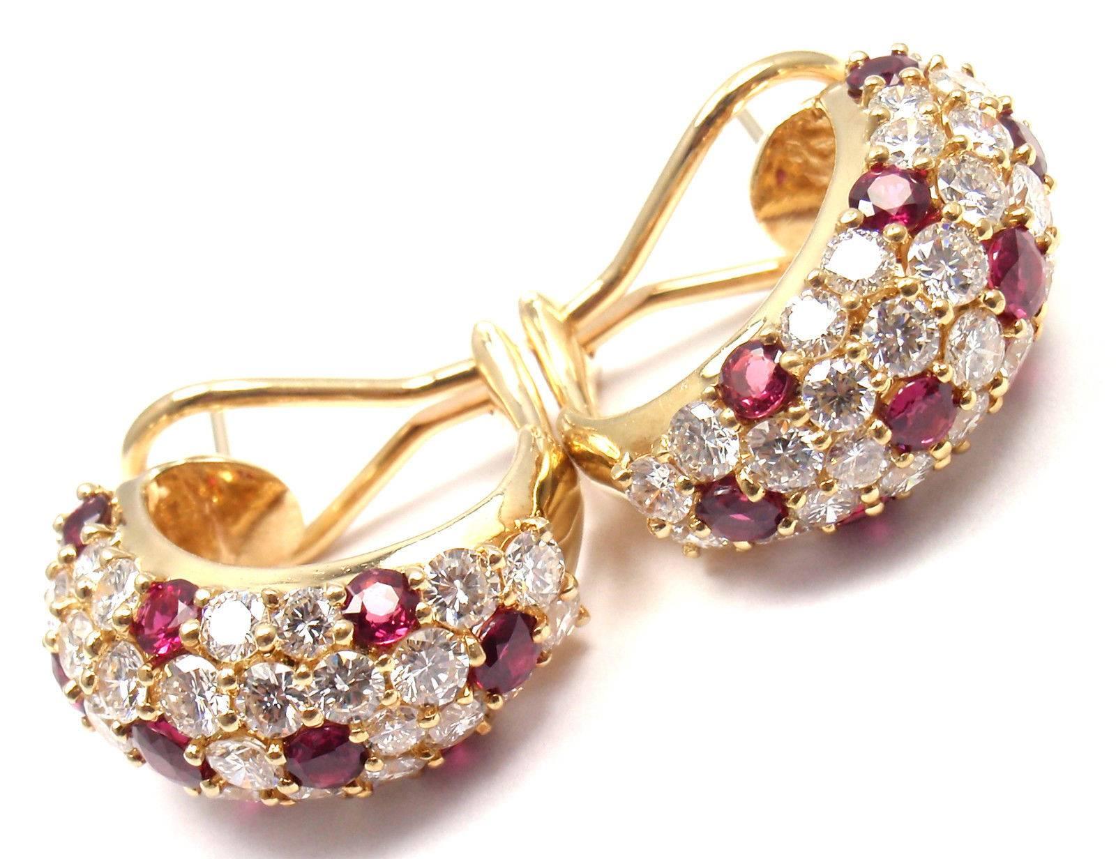 18k Yellow Gold Diamond And Ruby Hoop Earrings by Tiffany & Co. 
With 64 round brilliant cut diamonds VS1 clarity, G color total weight approx. 4ct
20 round rubies total weight approx. 2ct
These earrings are for pierced ears.

Details: 
Weight: