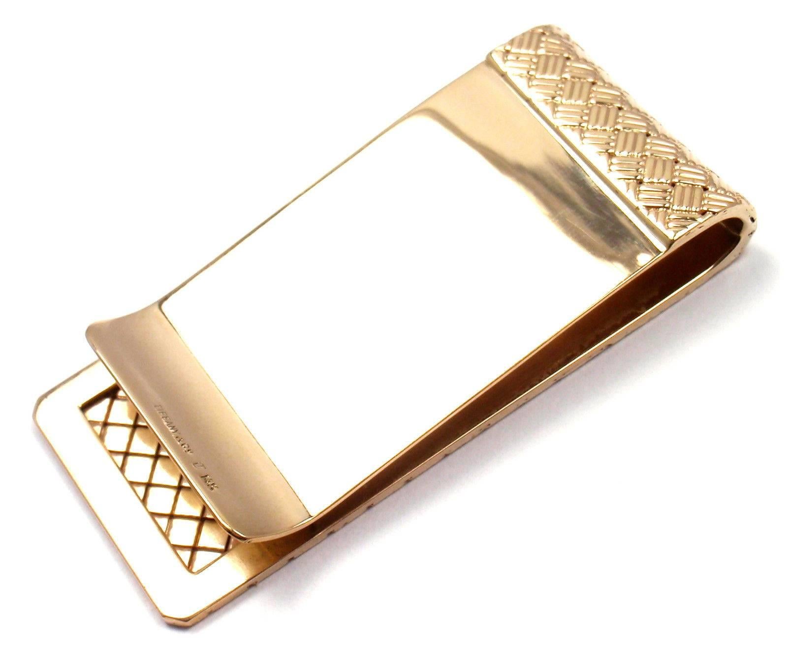 14k Yellow Gold Vintage Money Clip by Tiffany & Co. 

Details: 
Weight:  26.6 grams
Measurements: 56mm x 26mm
Stamped Hallmarks: Tiffany & Co 14k
*Free Shipping within the United States*

YOUR PRICE: $2,700

  T1442mdhd