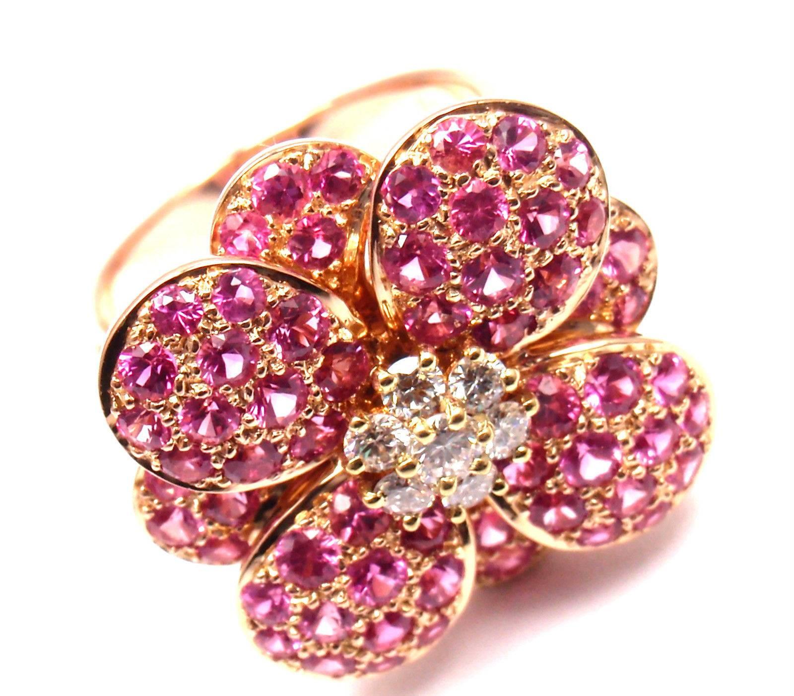 18k Rose Gold Diamond And Pink Sapphire Flower Ring by Van Cleef & Arpels.
With 7 round brillaint cut diamonds VVS1 clarity, E color and pink sapphires.
This ring comes with Van Cleef & Arpels box.

Details:
Size:   6
Width: 21mm
Weight: 13