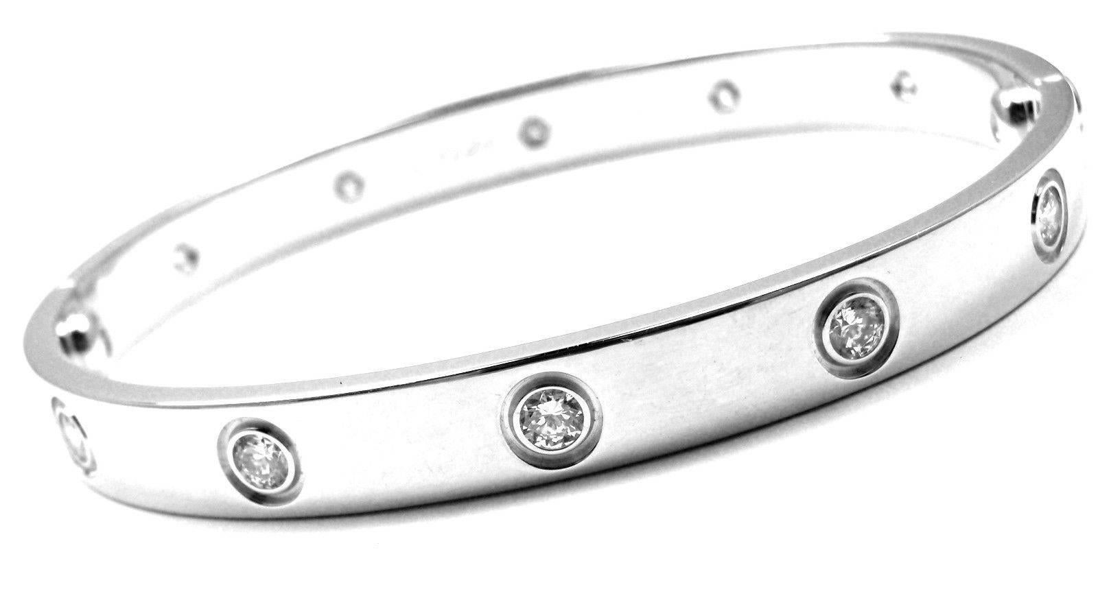 18k White Gold 10 Diamond Cartier LOVE Bangle Bracelet, size 16.
With 10 brilliant round cut diamonds, VS1 clarity, E-F color total weight approx. .50ct
This bracelet comes with a Cartier box, screwdriver and service paper from Cartier store.
Retail