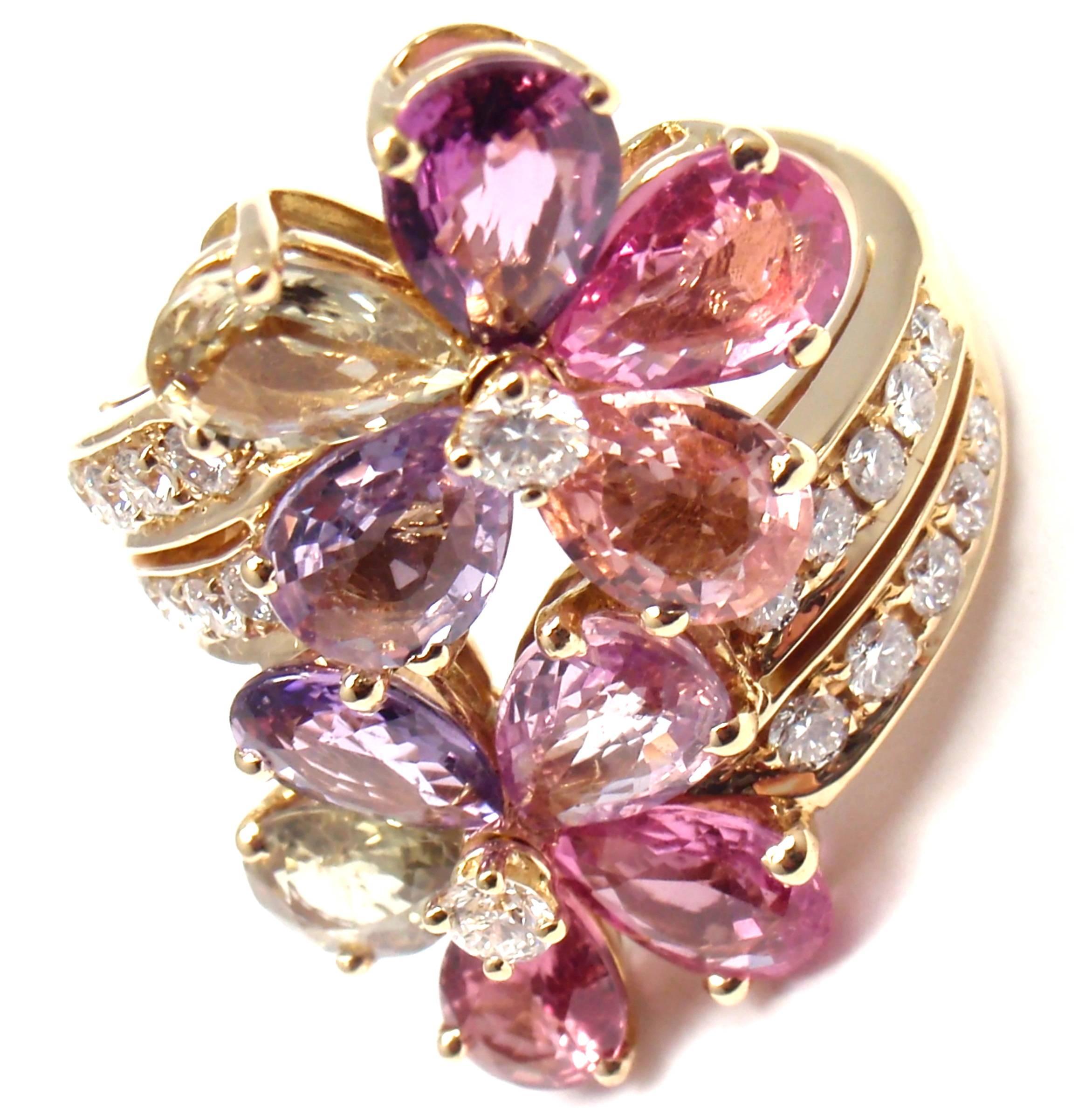 18k Yellow Gold Fancy Color Sapphire Flower Ring By Bulgari.
With 22 round brilliant cut diamonds VS1 clarity, E color total weight approx. .80ct
10 peat shape fancy color sapphires total weight approx. 9ct
This ring comes with original Bulgari