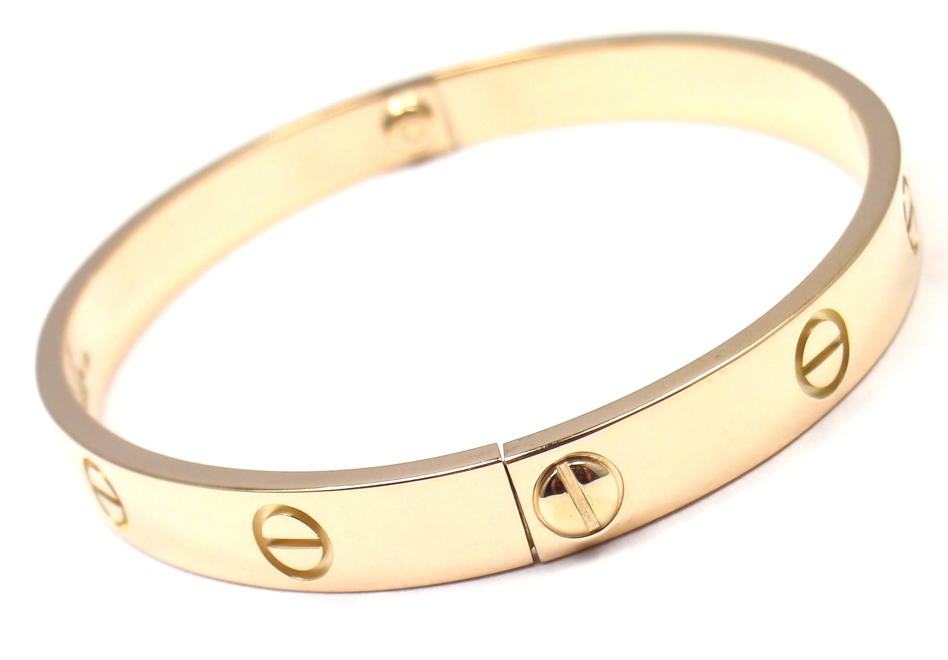 18k Yellow Gold Love Bangle Bracelet by Cartier Size 18.
This bracelet comes with a Cartier box and a Cartier screwdriver.

Details: 
Size: 18
Weight: 31.9 grams
Width: 6.5mm 
Hallmarks: Cartier 750 18 D22290

*Free Shipping within the United