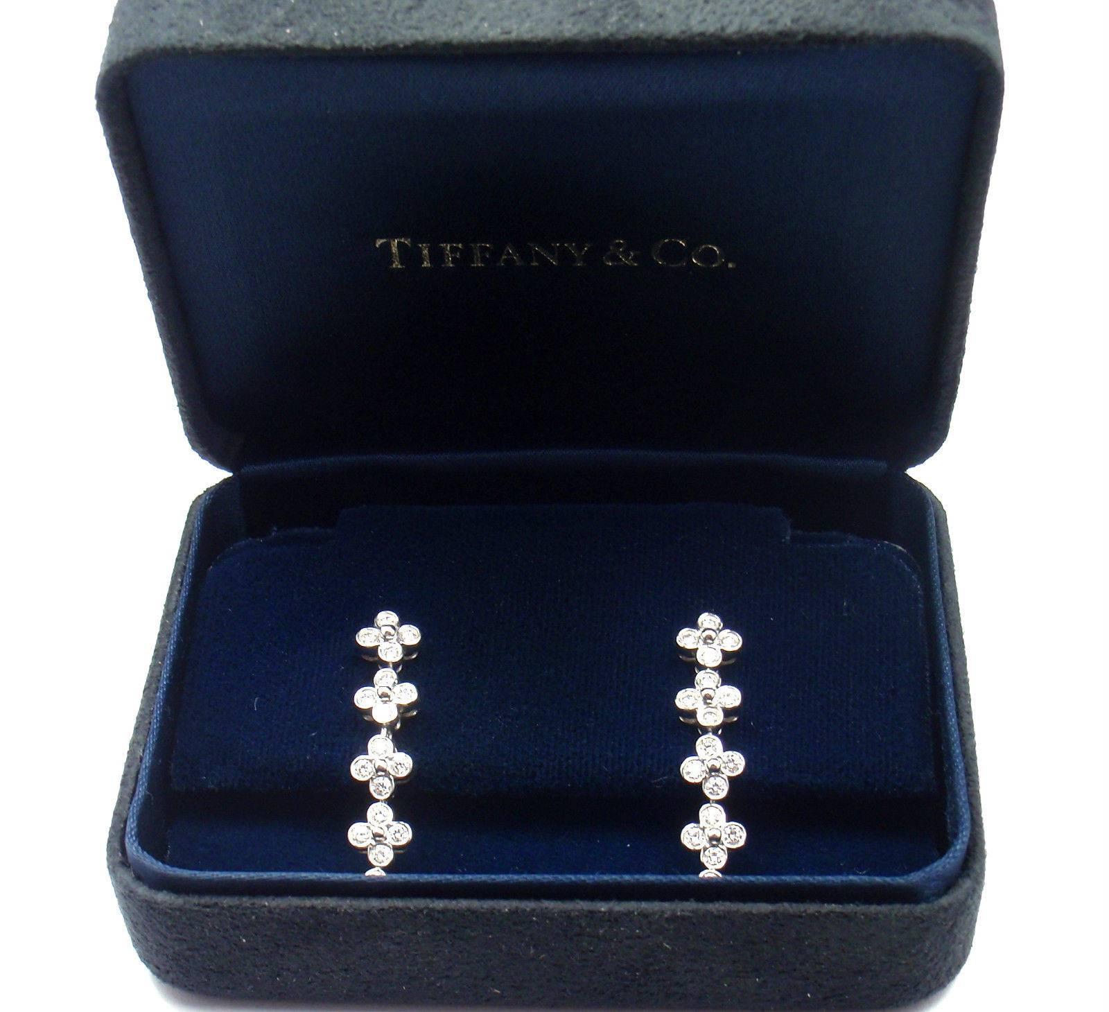 Platinum Diamond Drop Dangle 5 Flower Lace Earrings by Tiffany & Co. 
With 40 round brilliant cut diamonds  
t/w = .80ct  VS1 clarity G color
These earrings are made for pieced ears.
These earrings come with Tiffany & Co Box and a Replacement