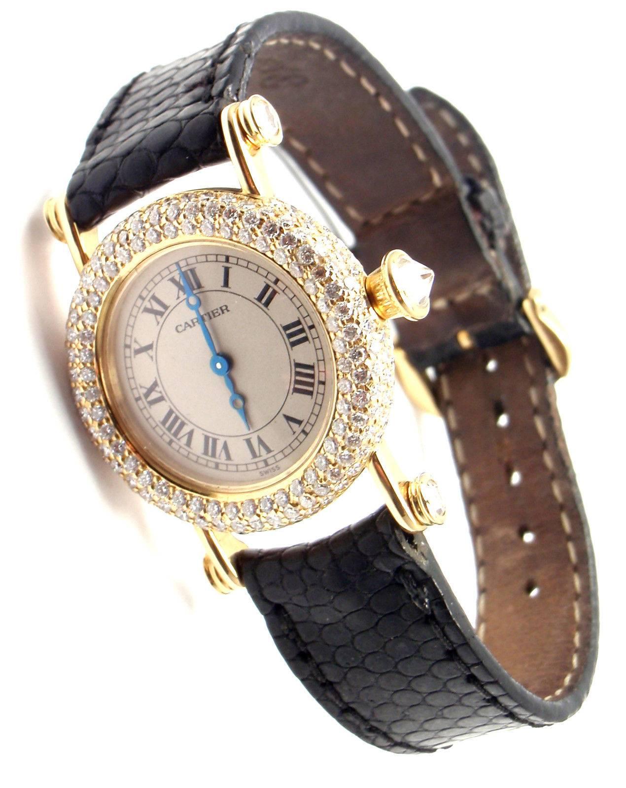 18k Yellow Gold Diamond Diabolo Ladies Wristwatch by Cartier. 

Brand: Cartier
Style Number: Diabolo
Series: Medium Size
Case Material: 18k Yellow Gold with Diamonds
Dial Color: Off white with Roman Numerals
Movement: Quartz
Functions: Hours,