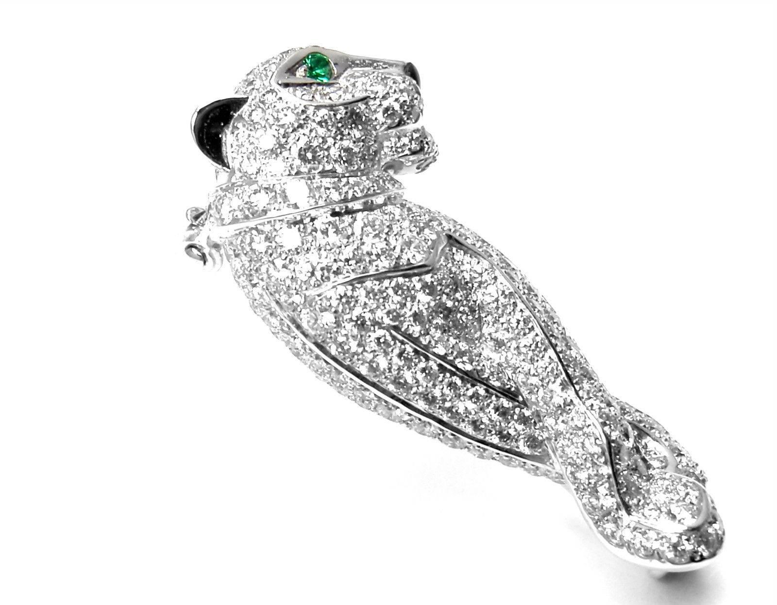 18k White Gold Diamond, Black Onyx nose and Emerald Panther 
Pin Brooch by Cartier. 
With 222 Round brilliant cut diamonds VVS1 clarity E color
1 Emerald.
This brooch comes with an original Cartier box.

Details:
Measurements: 30mm x 14mm
Weight: