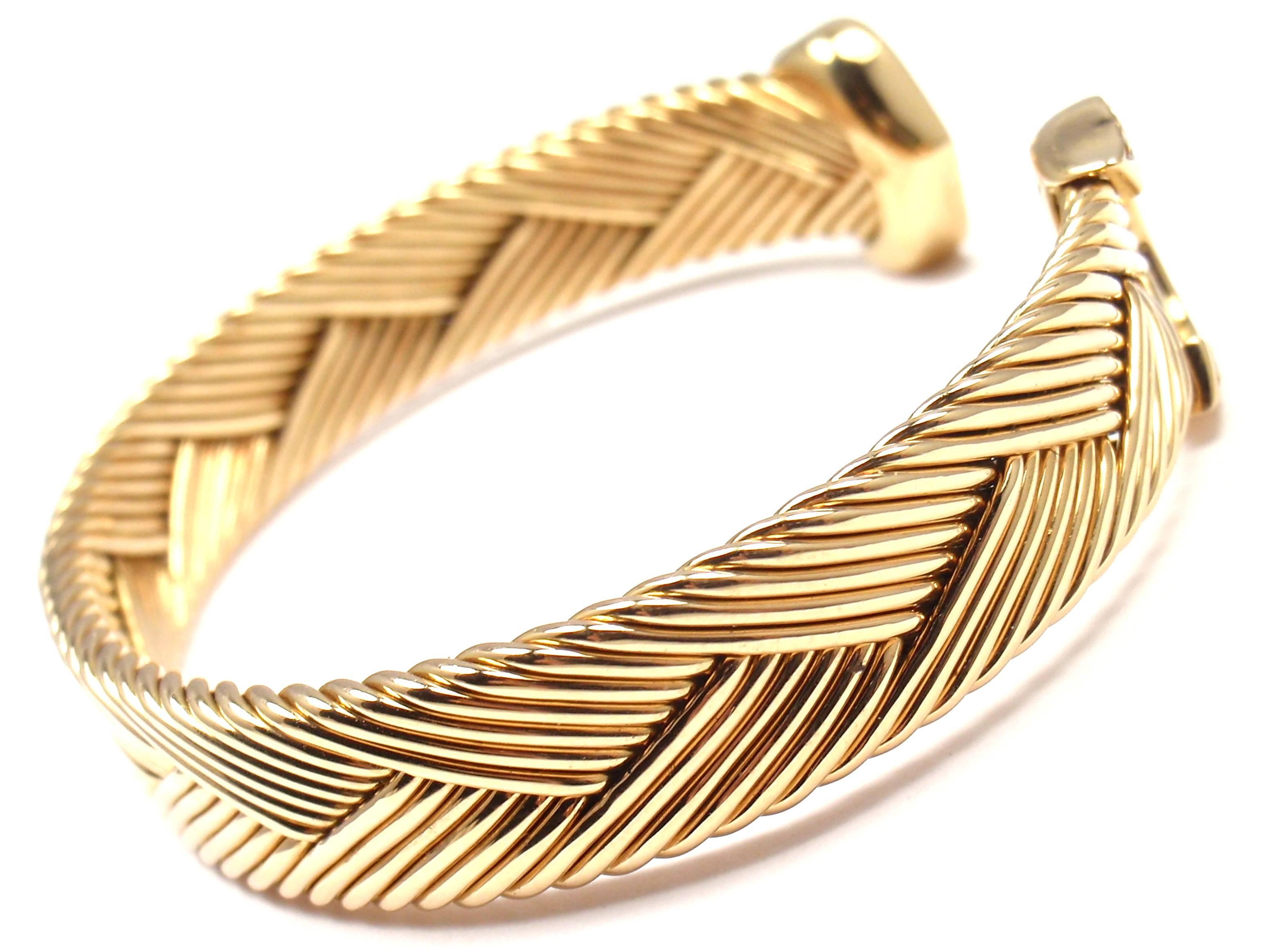 18k Yellow Diamond Double-C Bangle Cuff Bracelet by Cartier. 
This bracelet comes with an original Cartier box and service paper.
With Diamonds: 22x VS1 Diamonds
0.30ctw

Details: 
Weight: 33.4 grams
Length:  6.75