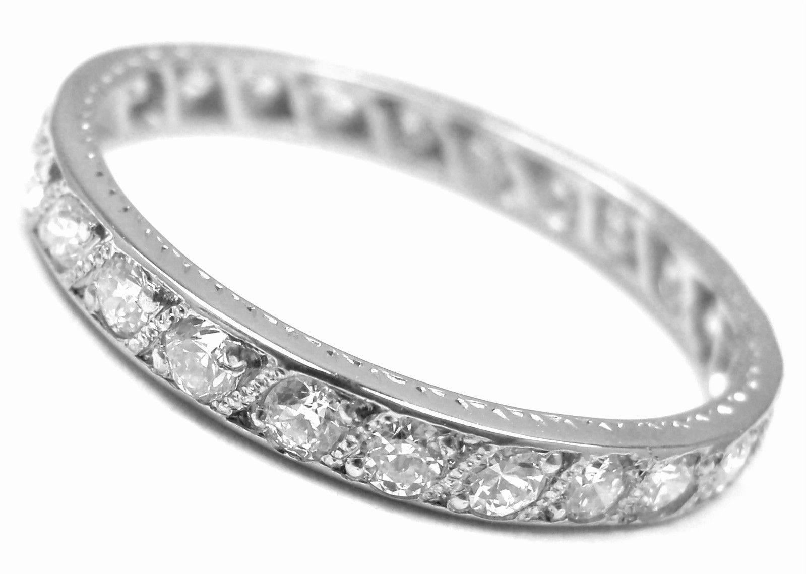 Vintage Platinum Diamond Eternity Wedding Band Ring by Tiffany & Co.
With 26 round brilliant cut diamonds VVS1 clarity, E color total weight approx. .52ct
Measurements: 
Ring Size: 6 1/4
Weight: 2.1 grams
Band Width: 2.5mm
Stamped Hallmarks: Tiffany