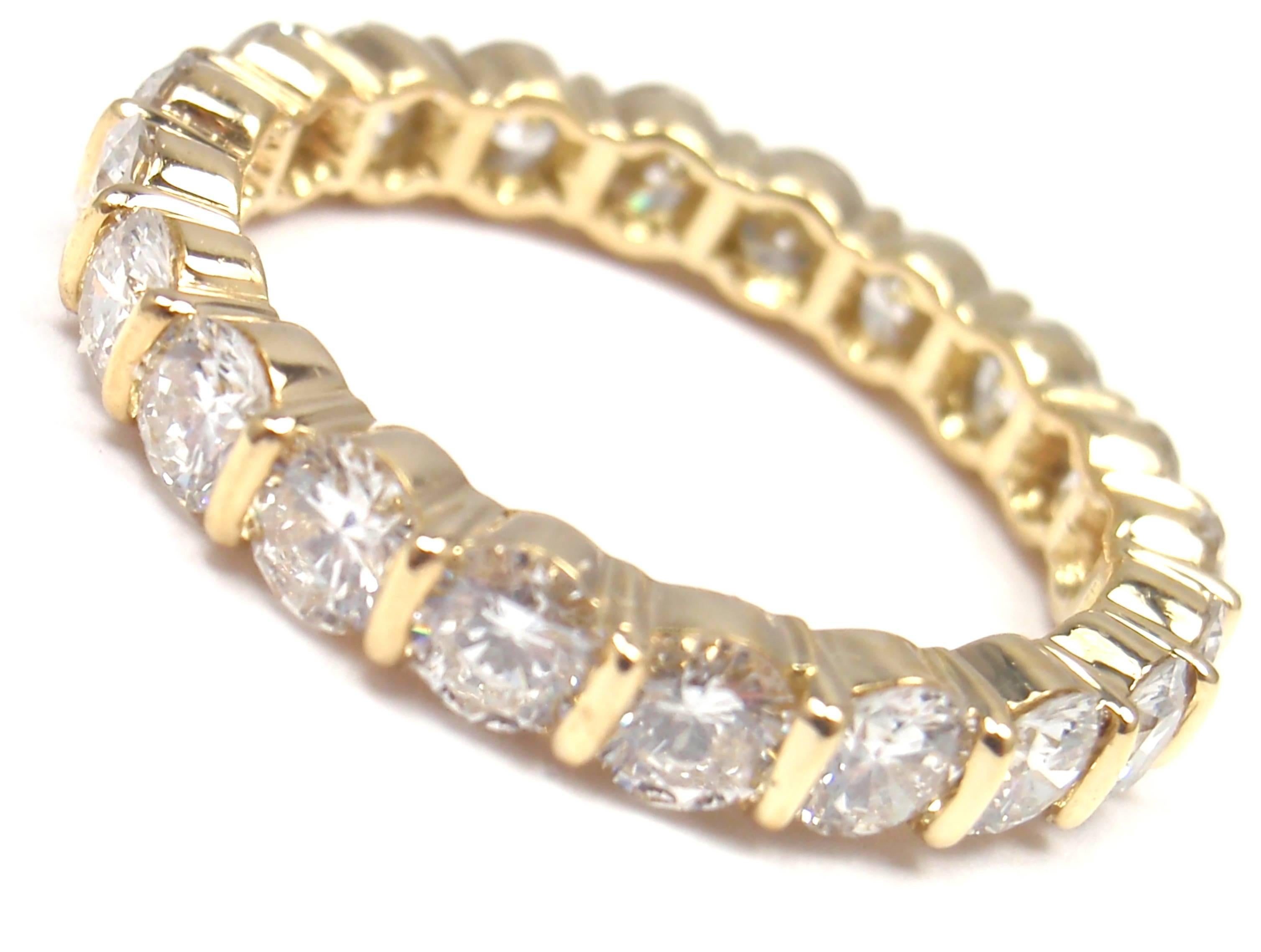 18k Yellow Gold Diamond Eternity Wedding Band Ring by Tiffany & Co. 
With 20 round brilliant cut diamonds VS1 clarity, G color total weight 
approx. 2ct
Details: 
Ring Size: 6
Weight: 2.7 grams 
Width: 3.5mm 
Stamped Hallmarks: T&Co 750

*Free