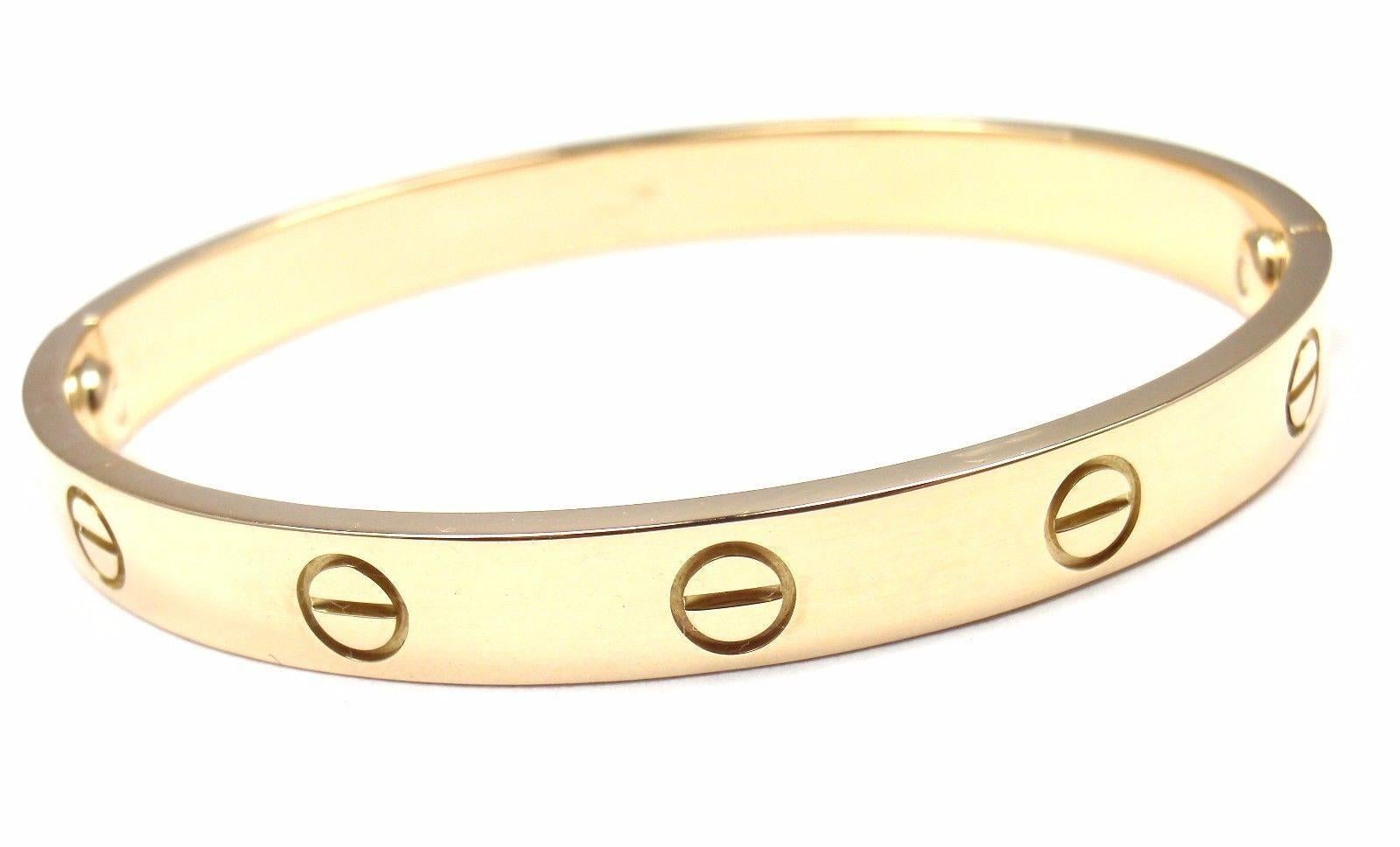 18k Yellow Gold Love Bangle Bracelet by Cartier Size 16.
This bracelet comes with a Cartier box, Cartier certificate and Cartier screwdriver.

Details: 
Size: 16
Weight: 29.4 grams
Width: 6.5mm 
Hallmarks: Cartier 750 16 M08287

*Free Shipping
