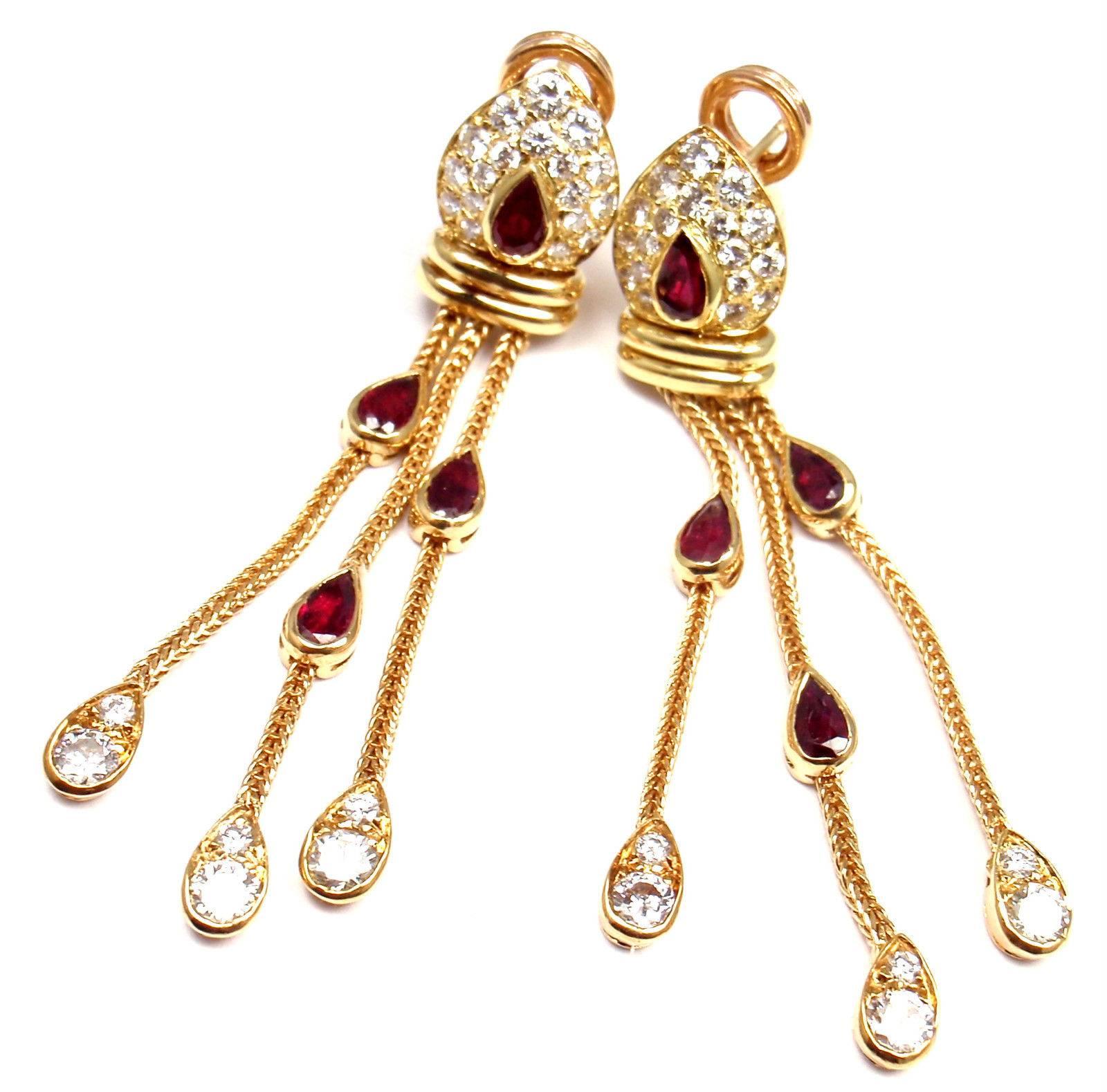 18k Yellow Gold Diamond And Ruby Vintage Hanging Earrings by Van Cleef & Arpels. 
These earrings are clips, made for pierced ears. 
With 48 round brilliant cut diamonds VVS1 clarity, E color total weight approx. 1.35ct
8 pear shape rubies total