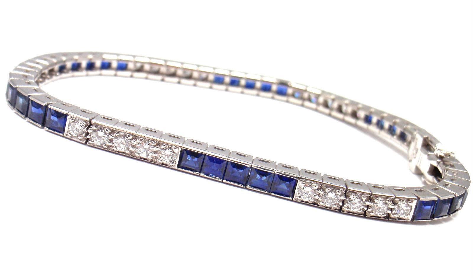 Irid Platinum Diamond And  Sapphire Line Tennis Bracelet by Cartier. 
This bracelet comes with Cartier paper and Cartier box.
With 30 round brilliant cut diamonds VVS1 clarity, E color 
total weight approx. 1.58ct
30 square cut sapphires total