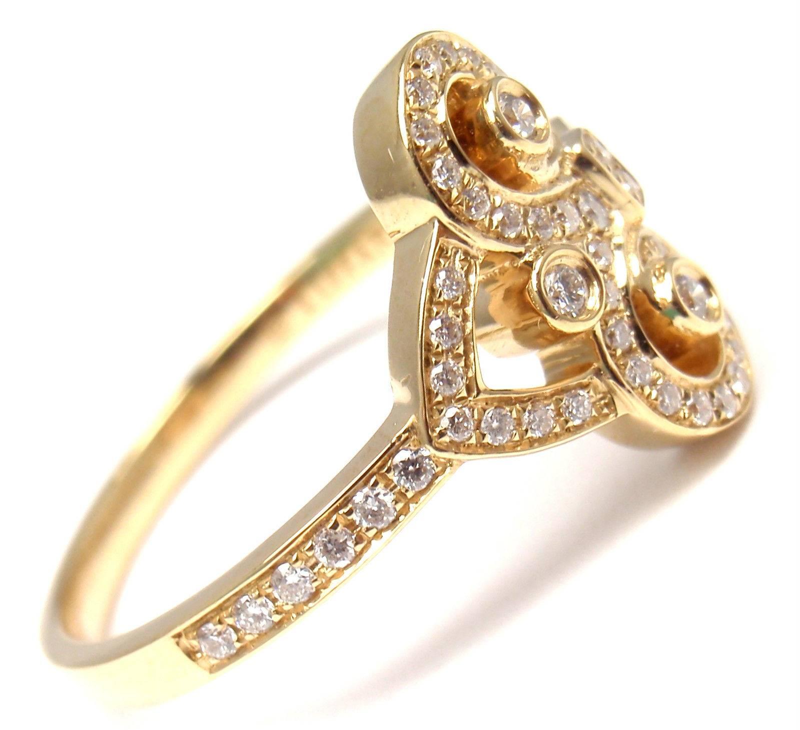 18k Yellow Gold Diamond Fleur de Lis Key Band Ring by Tiffany & Co.
With Round brilliant cut diamonds VS1 clarity, G color total weight approx. .21ct
This ring comes with Tiffany & Co box.
Measurements: 
Ring Size: 7
Weight: 4.5 grams
Band Width: