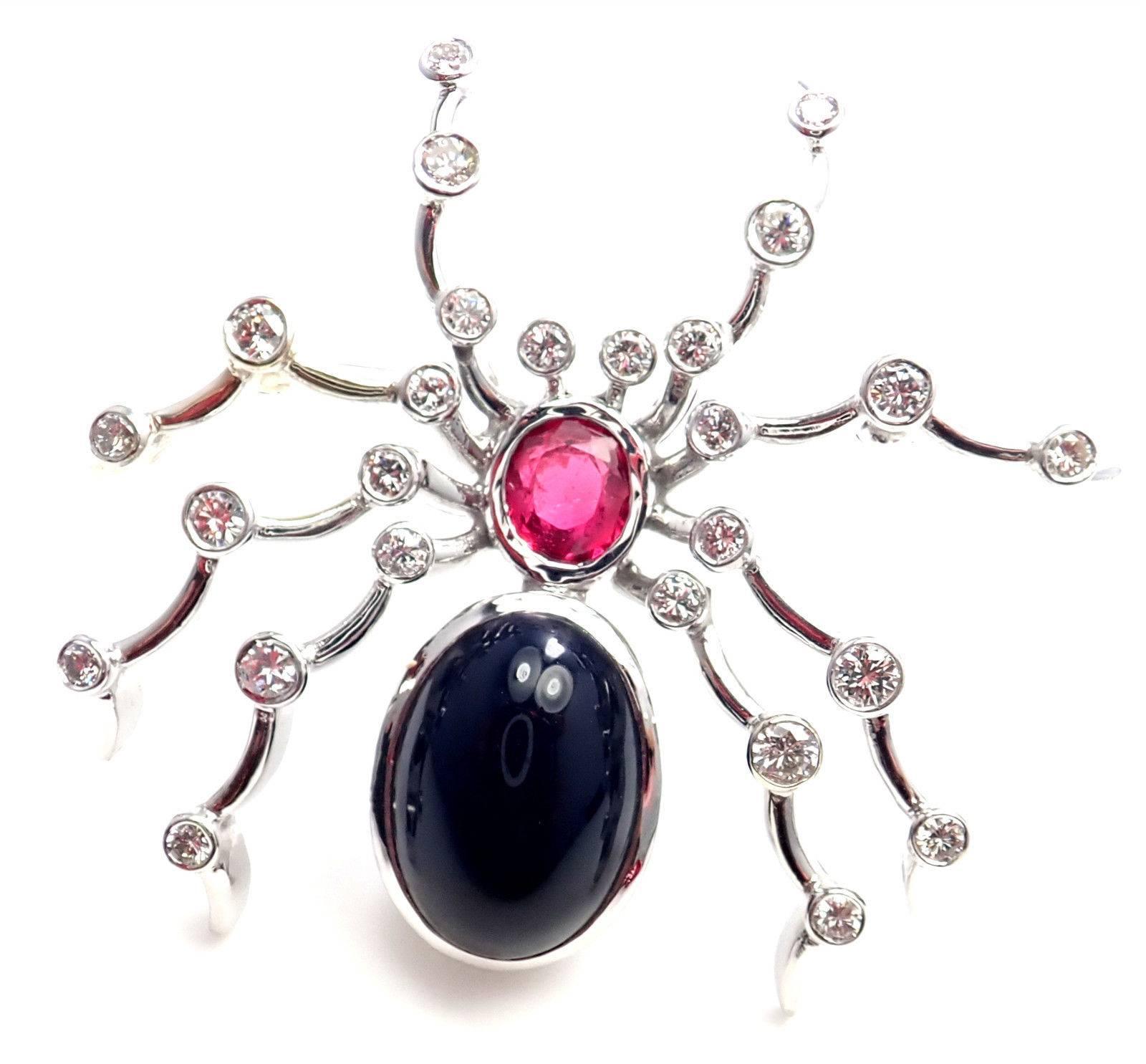 18k White Gold Diamond Ruby Black Onyx Spider Pin Brooch by Paloma Picasso for Tiffany & Co. 
With 26 round brilliant cut diamonds VS1 clarity, G color total weight approx. 1ct
1 ruby 8mm x 4mm
1 black onyx 14mm x 11mm
Details: 
Measurements: 1 1/2