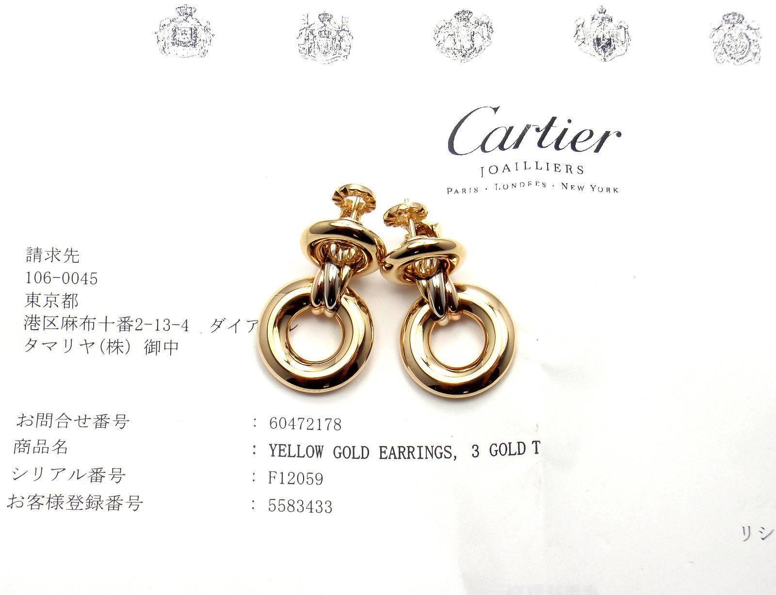 18k Tri-Colored Gold (Yellow, White, Rose) Cartier Trinity Earrings by Cartier. 
These earrings come with an original Cartier box and a service paper from Cartier store in Japan.
These earrings are for pierced ears. 

Details: 
Weight:  22.3