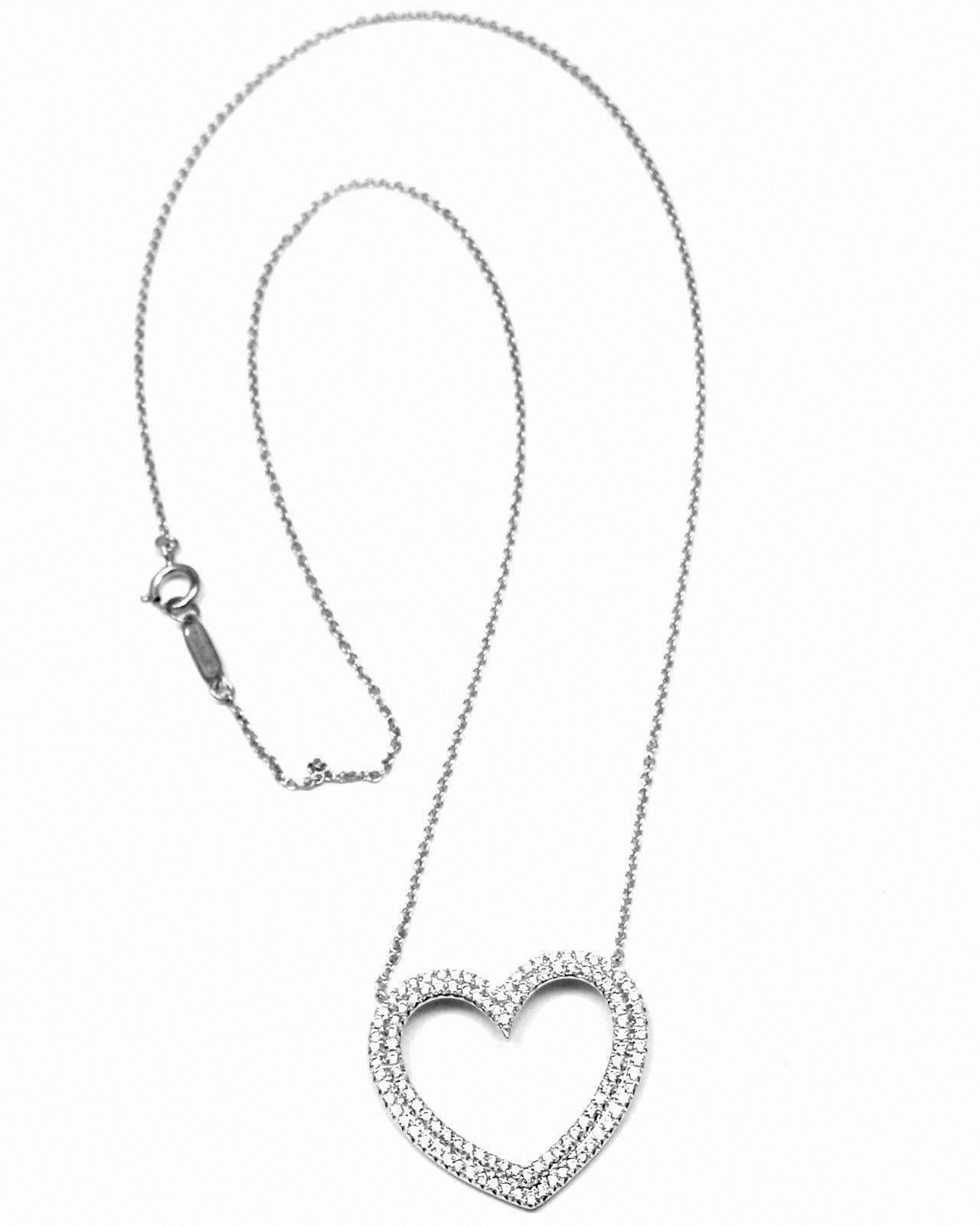 18k White Gold Metro Diamond Large Heart Pendant Necklace by Tiffany & Co.
With round diamonds VS1 clarity, G color total weight approx. .50ct
This necklace comes with Tiffany & Co. box.
Details:
Length: 17.5
