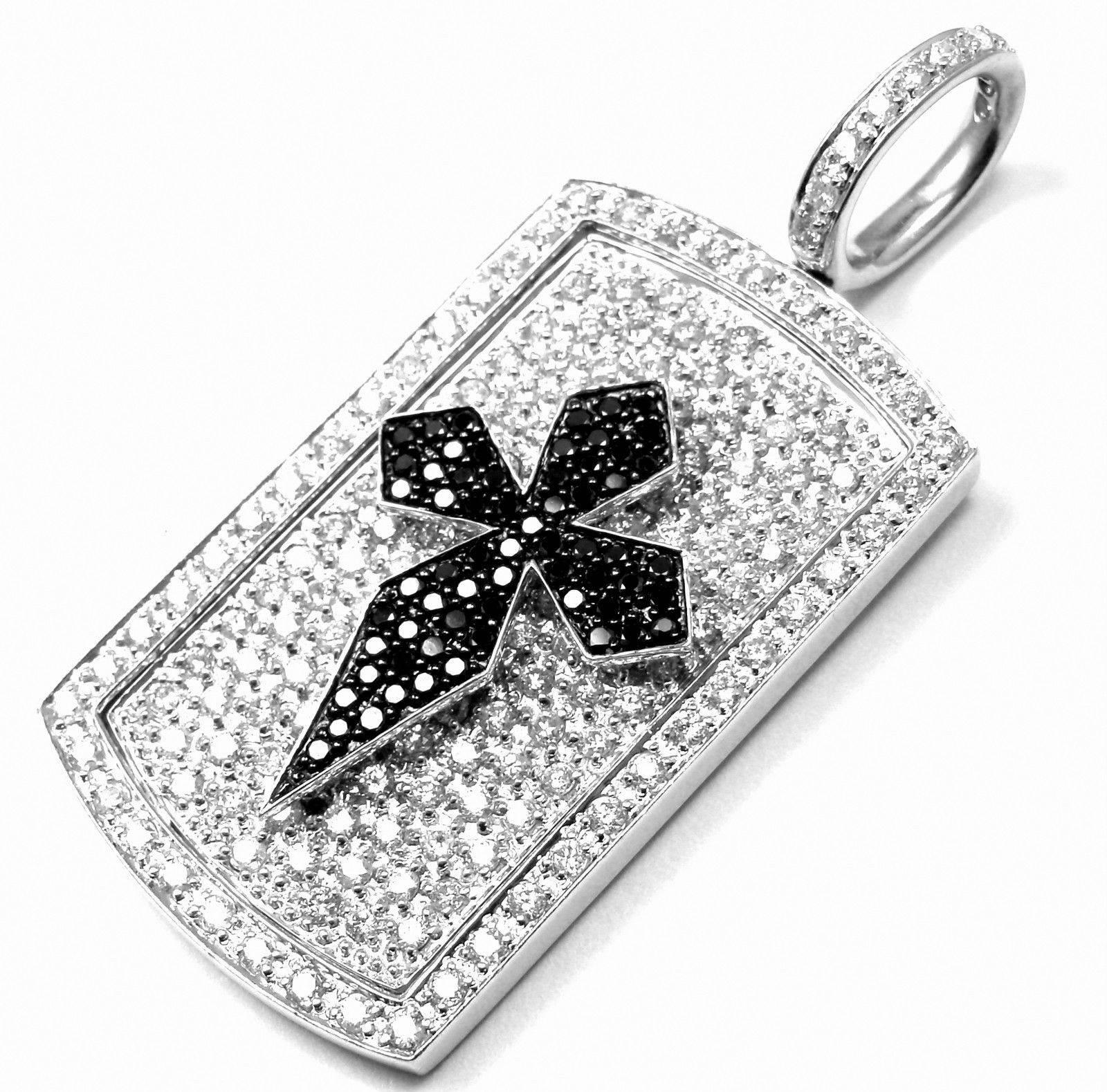 14k White Gold Black & White Diamond Cross Charm Pendant from Estate of Jackie Collins.
With Round white and black diamonds total weight approx. 4.25ct
Details: 
Weight: 24.5 grams
Measurements: 2 1/4