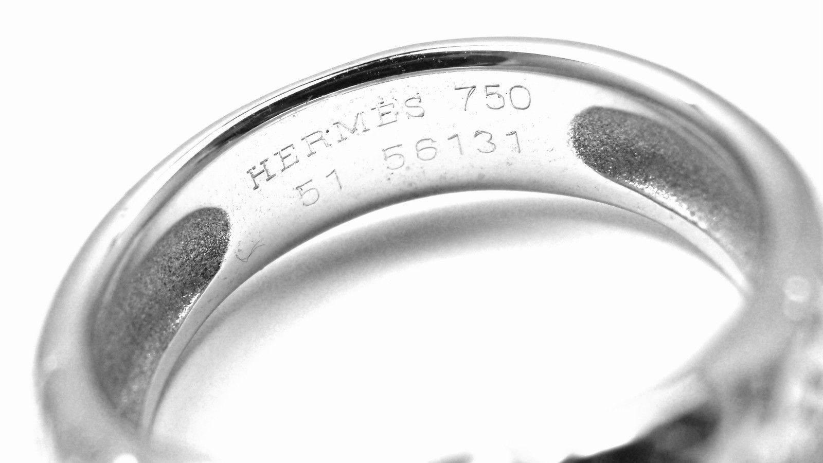 18k White Gold H Motif Band Ring by Hermes. 
Details: 
Ring Size: European 51 US 5 3/4
Weight: 7.6 grams
Band Width: 6mm
Stamped Hallmarks: HERMES 750 51 56131
*Free Shipping within the United States*
YOUR PRICE: $1,200
T1624eod