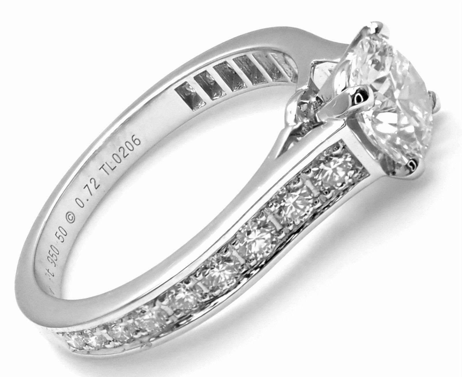 Platinum 1.62ctw Diamond Engagement Solitaire Engagement Ring by Cartier. 
With 1 round brilliant cut diamonds VS1 clarity, G color total weight approx. .72ct
Excellent Cut, Polish and Symmetry
Fluorescence NONE!
18 round brilliant cut diamonds VS1