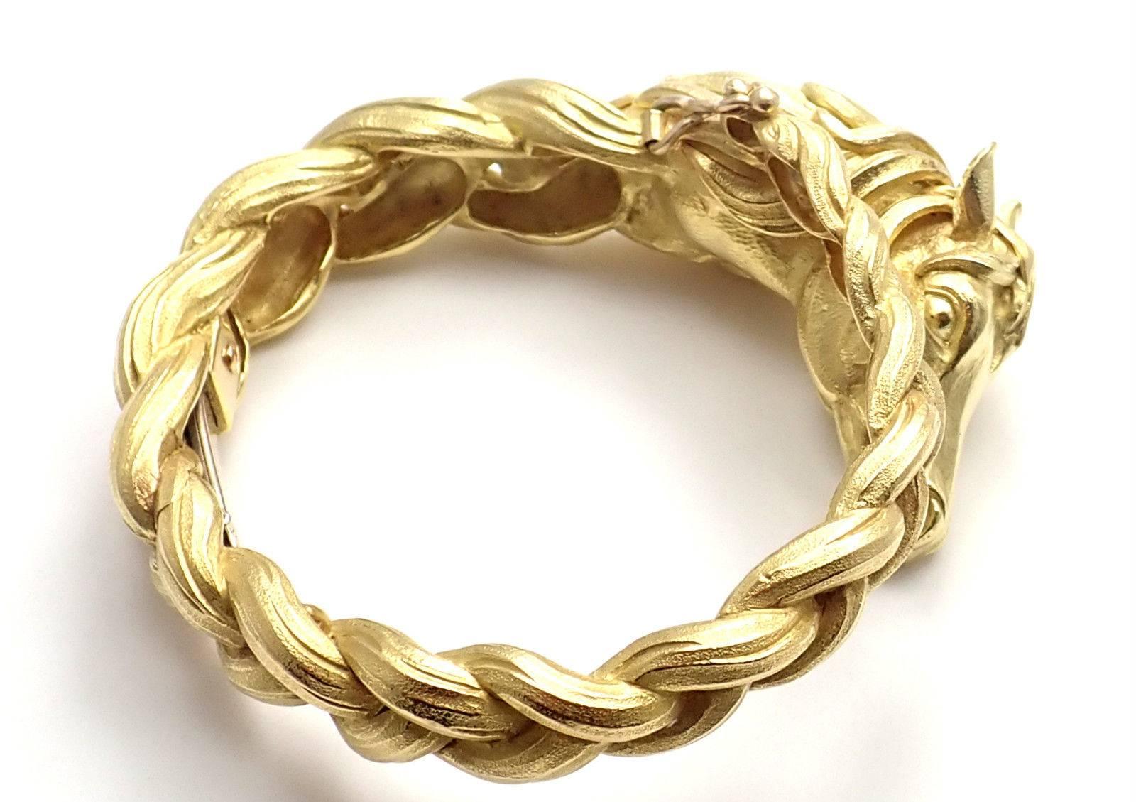 18k Yellow Gold Sculpted Horse Bangle Bracelet by Hermes. 
Details: 
Length: Length: 7" 
Width: 1"
Weight: 125.4 grams
Stamped Hallmarks: Hermes Paris 72507 French Hallmarks
*Free Shipping within the United States*
YOUR PRICE:
