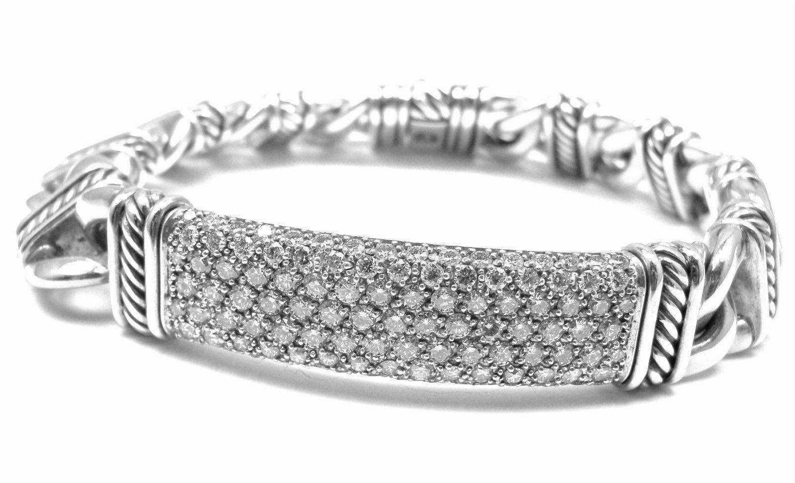 Sterling Silver White Diamond ID Link Bracelet by David Yurman from Estate of Jackie Collins.
This bracelet used to belong to Jackie Collins and was purchased from her jewelry estate collection.
With Round white diamonds total weight approx.