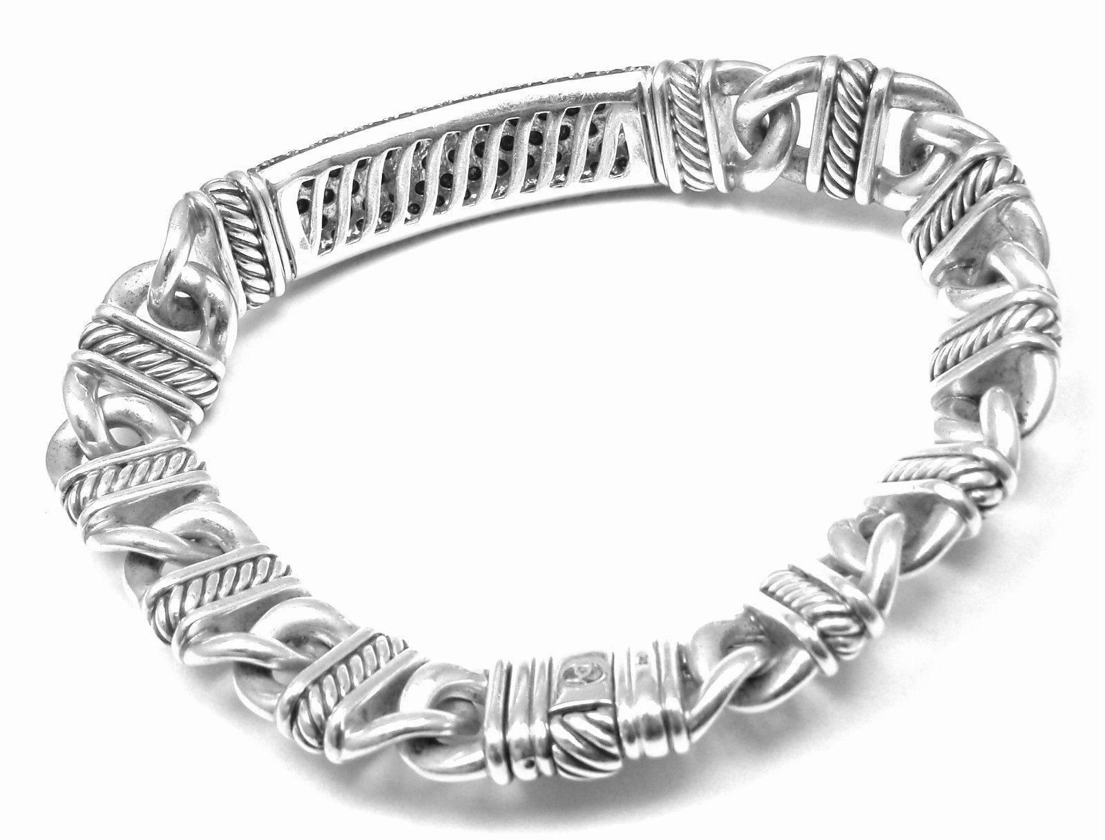 Sterling Silver Black Diamond ID Link Bracelet by David Yurman from Estate of Jackie Collins.
This bracelet used to belong to Jackie Collins and was purchased from her jewelry estate collection.
With Round white diamonds total weight approx.
