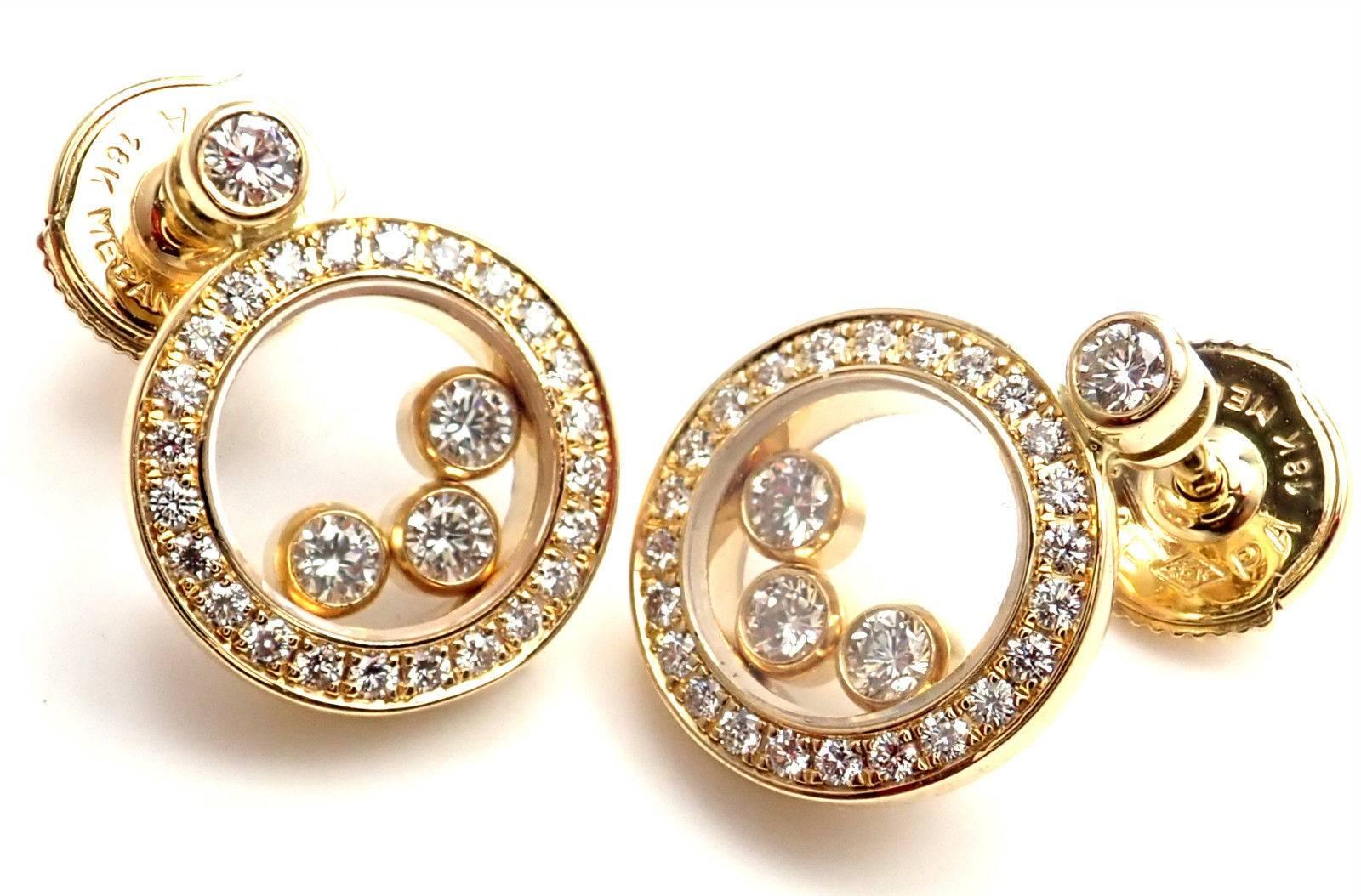 18k Yellow Gold Happy Diamond Round Earrings by Chopard.  
With 56 round brilliant cut diamond VS1 clarity, G color total weight .60ct
These earrings are for pierced ears.
Details:  
Measurements: 14mm x 11mm
Weight: 6.8 grams 
Stamped Hallmarks: