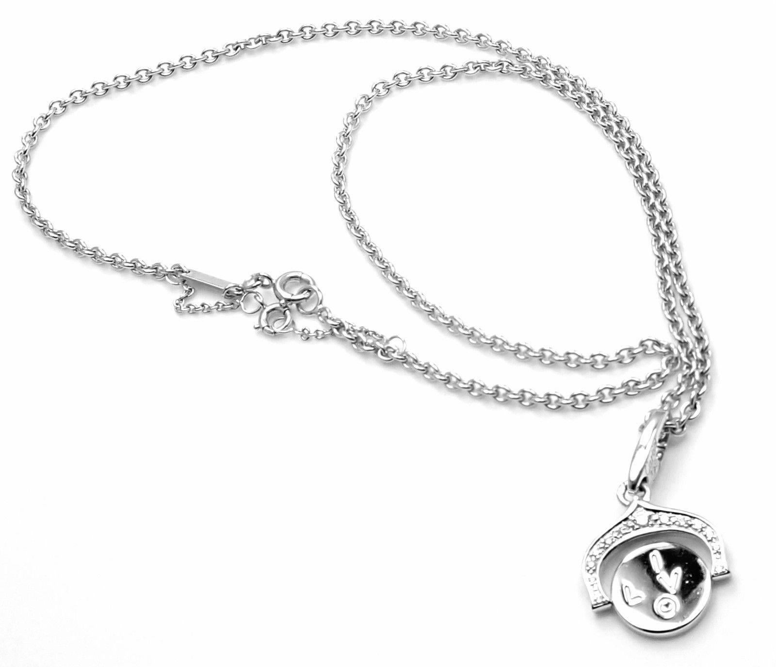 18k White Gold Diamond I Love You Charm Pendant Necklace by Cartier. 
With 13 round brilliant cut diamonds VVS1 clarity, E color total weight approx. .12ct
This pendant comes with Cartier certificate.
Details: 
Measurements: Chain Length: 16.5