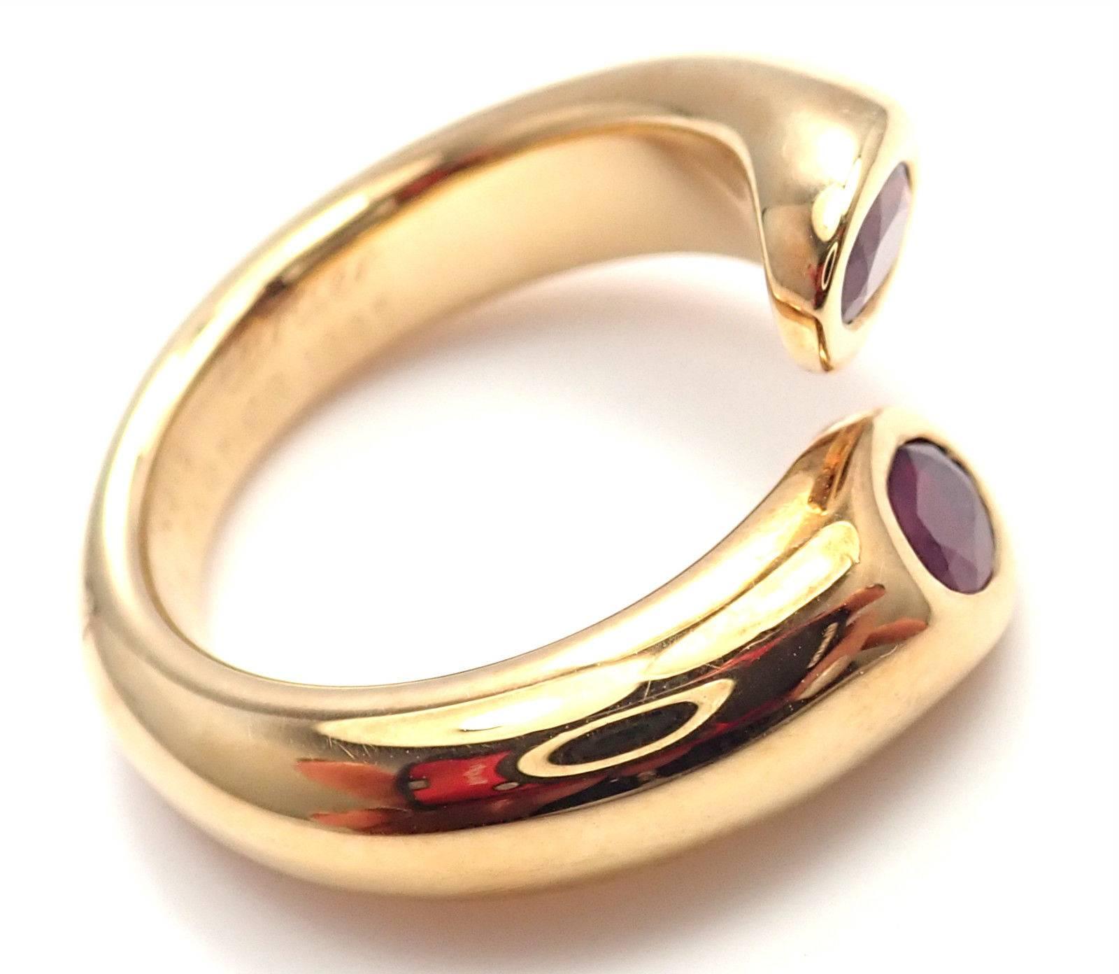 18k Yellow Gold Ellipse Deux Tetes Croisees Bypass Ruby Band Ring by Cartier.
With 2 oval cut rubies, approx 1.20ct
Metal: 18k Yellow Gold
Band Width: 9mm
Weight: 11.4 grams
Size:	European 52, US 6
Hallmarks: Cartier 750 52 D14619 1995
YOUR PRICE: