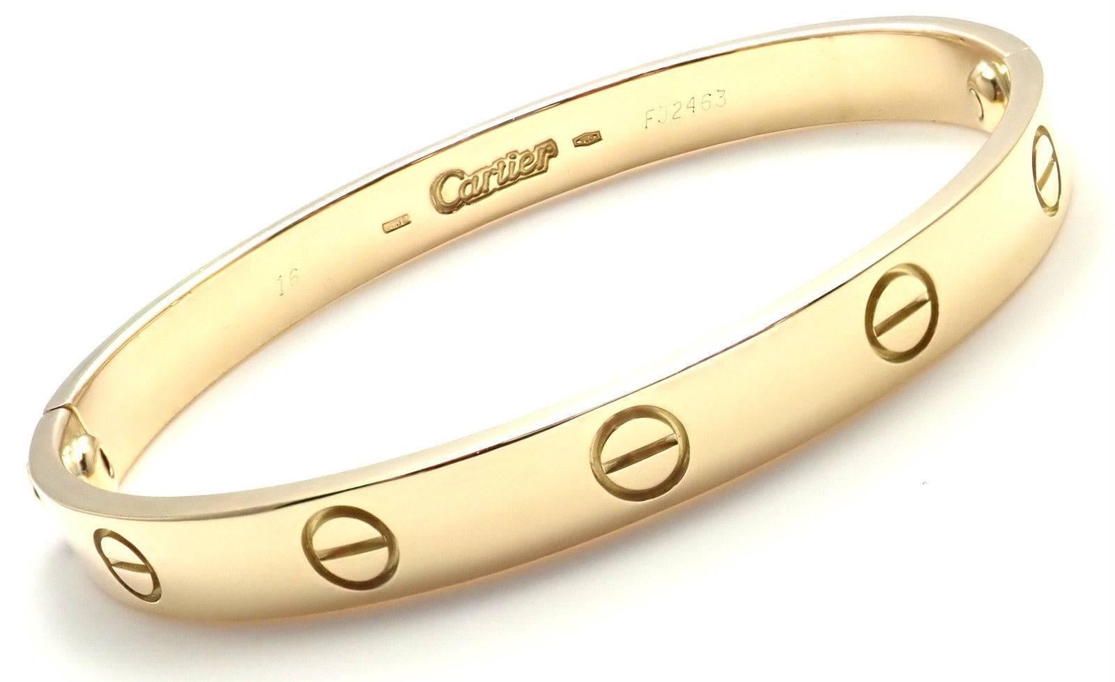 18k Yellow Gold Love Bangle Bracelet by Cartier Size 16.
This bracelet comes with a Cartier box, Cartier certificate a Cartier screwdriver.
Details: 
Size: 16
Weight: 28.7 grams
Width: 6.5mm 
Hallmarks: Cartier 750 16 F92463
*Free Shipping within