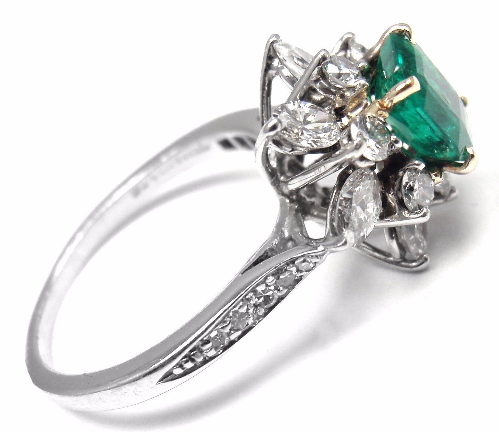 Irid Platinum Emerald Diamond Ring by Tiffany & Co. 
With 16 round shape diamonds and 6 marque cut diamonds VS1 clarity G color total weight approx. 1ct
1  Colombian emerald 6.64 x 5.50 x 3.22mm total weight is .82ct 
This ring comes with GIA