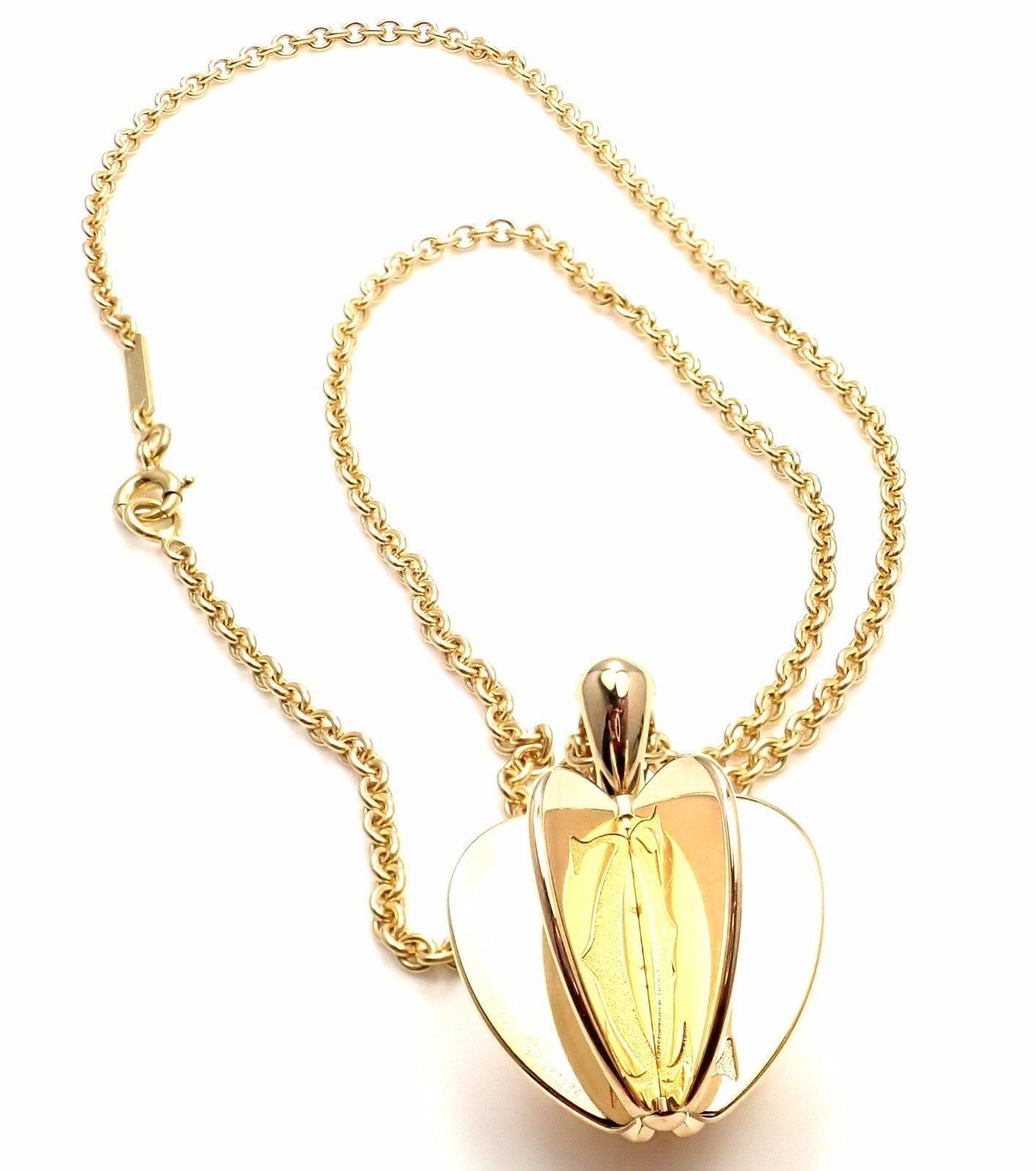 18k Yellow Gold Double C Apple Heart Pendant Necklace by Cartier. 
Details: 
Pendant: 27mm x 20mm
Chain: Length 16.5