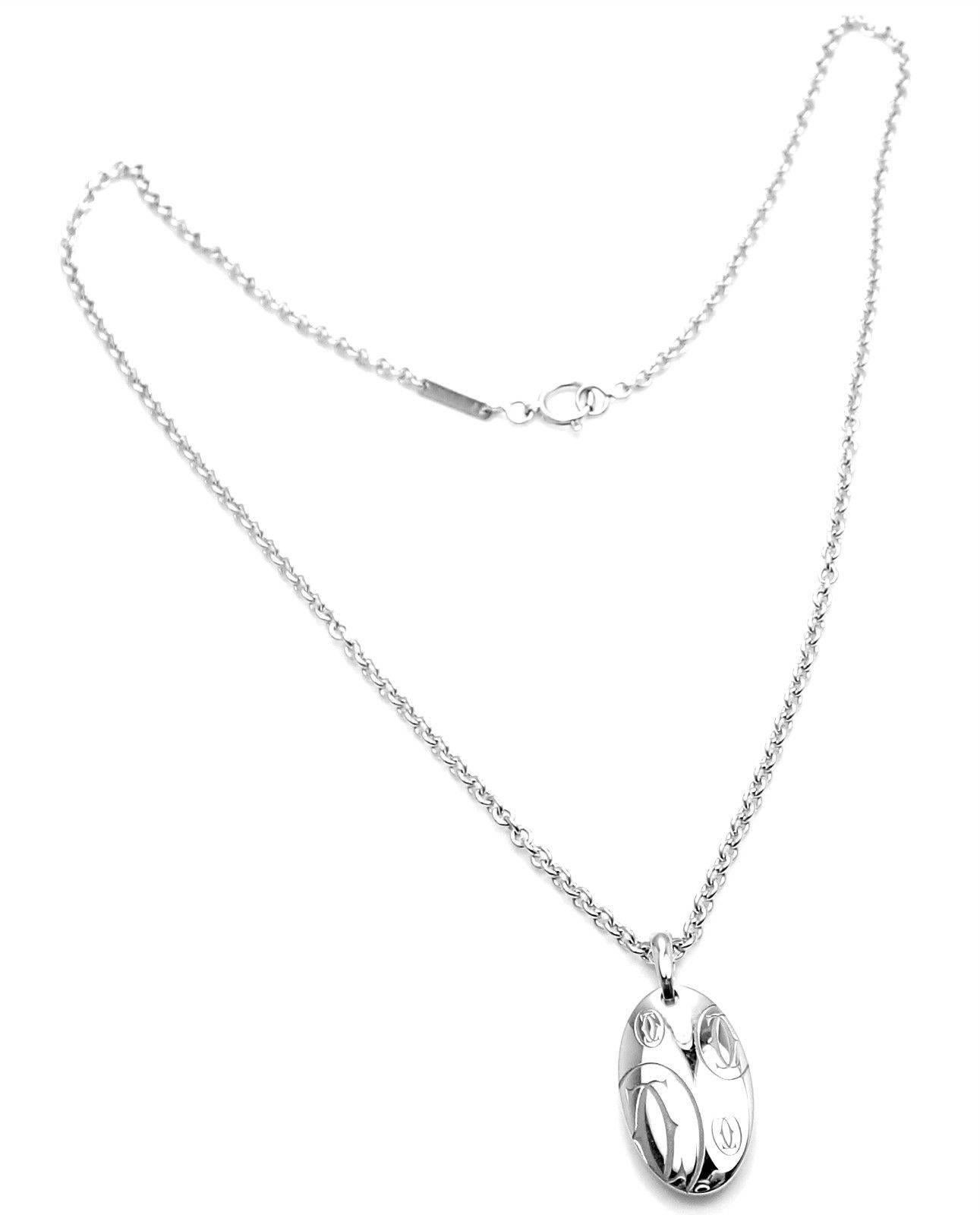 18k White Gold Happy Birthday Charm Pendant Necklace by Cartier. 
This pendant comes with Cartier certificate.
Details: 
Measurements: Length: Chain 16.25