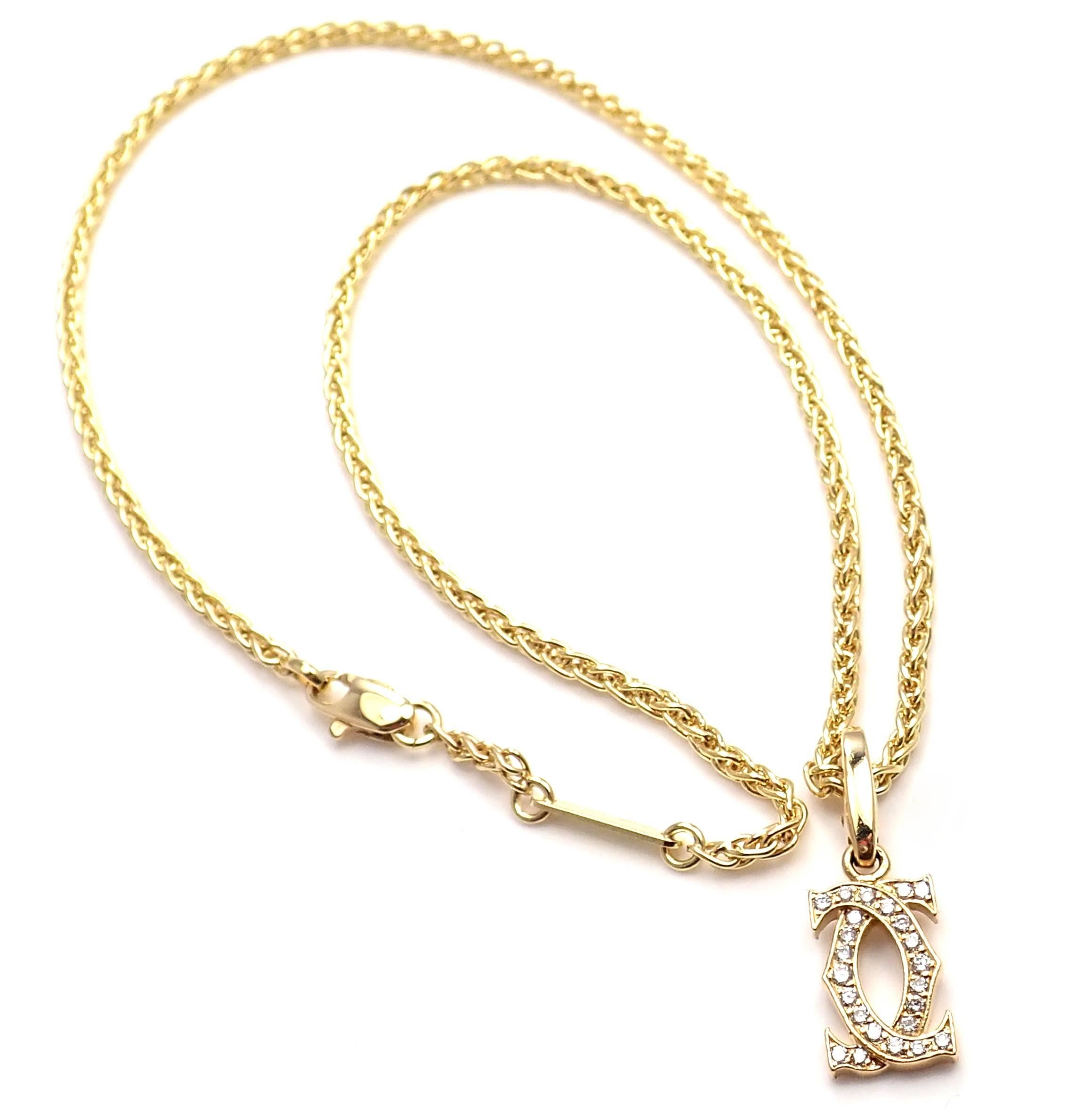 18k Yellow Gold Diamond Double C  Pendant Chain Necklace by Cartier. 
With 24 round brilliant cut diamonds VVS1 clarity, E color total weight approx. 0.25ctw
Details: 
Chain: Length 16.5