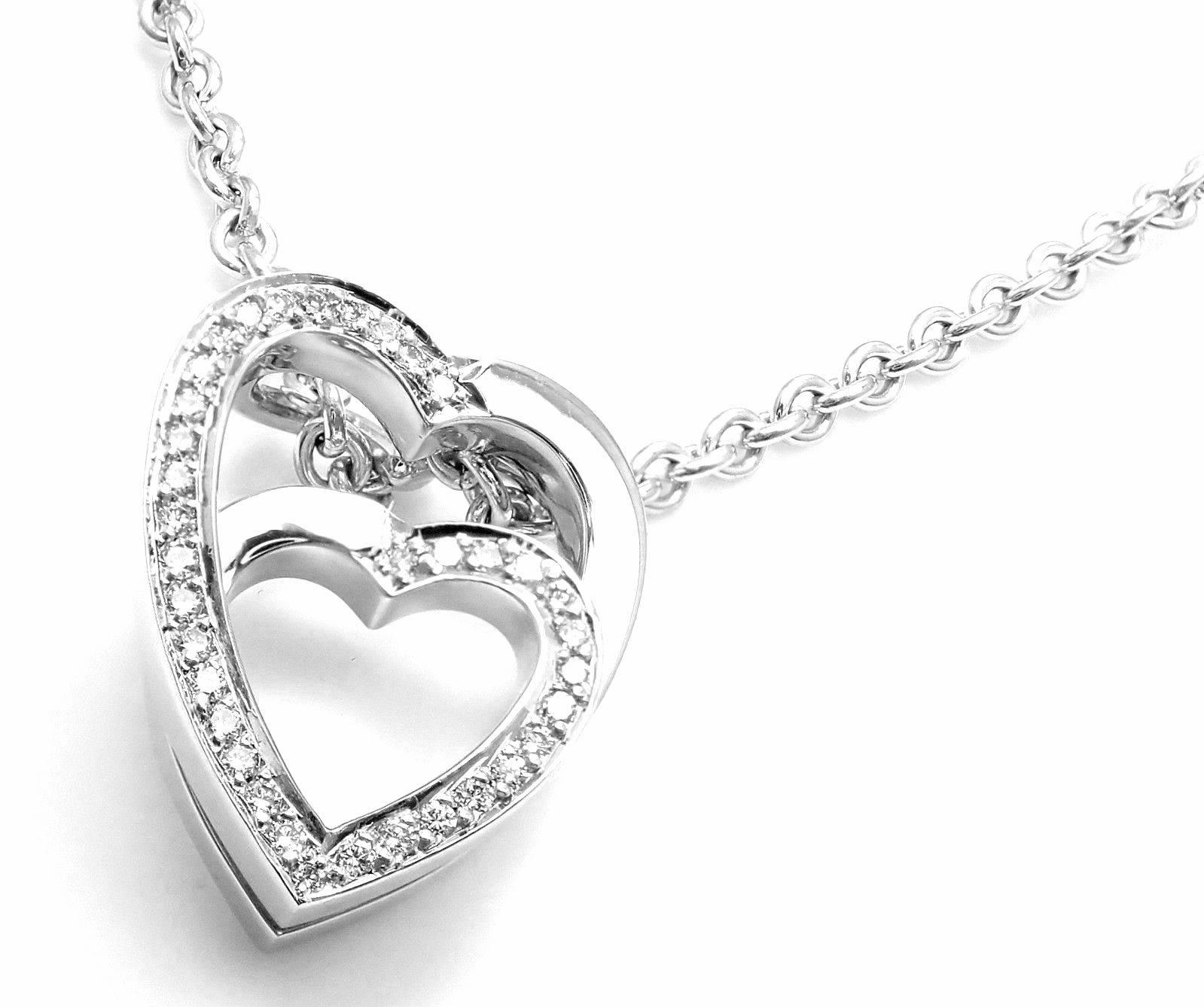 18k White Gold Diamond Nesting Double Heart Pendant Necklace by Cartier.
With 2 hearts connected continuously, with pave round brilliant cut diamonds
VVS1 clarity, E color total weight approx .25 ctw
This necklace is in mint condition and comes with